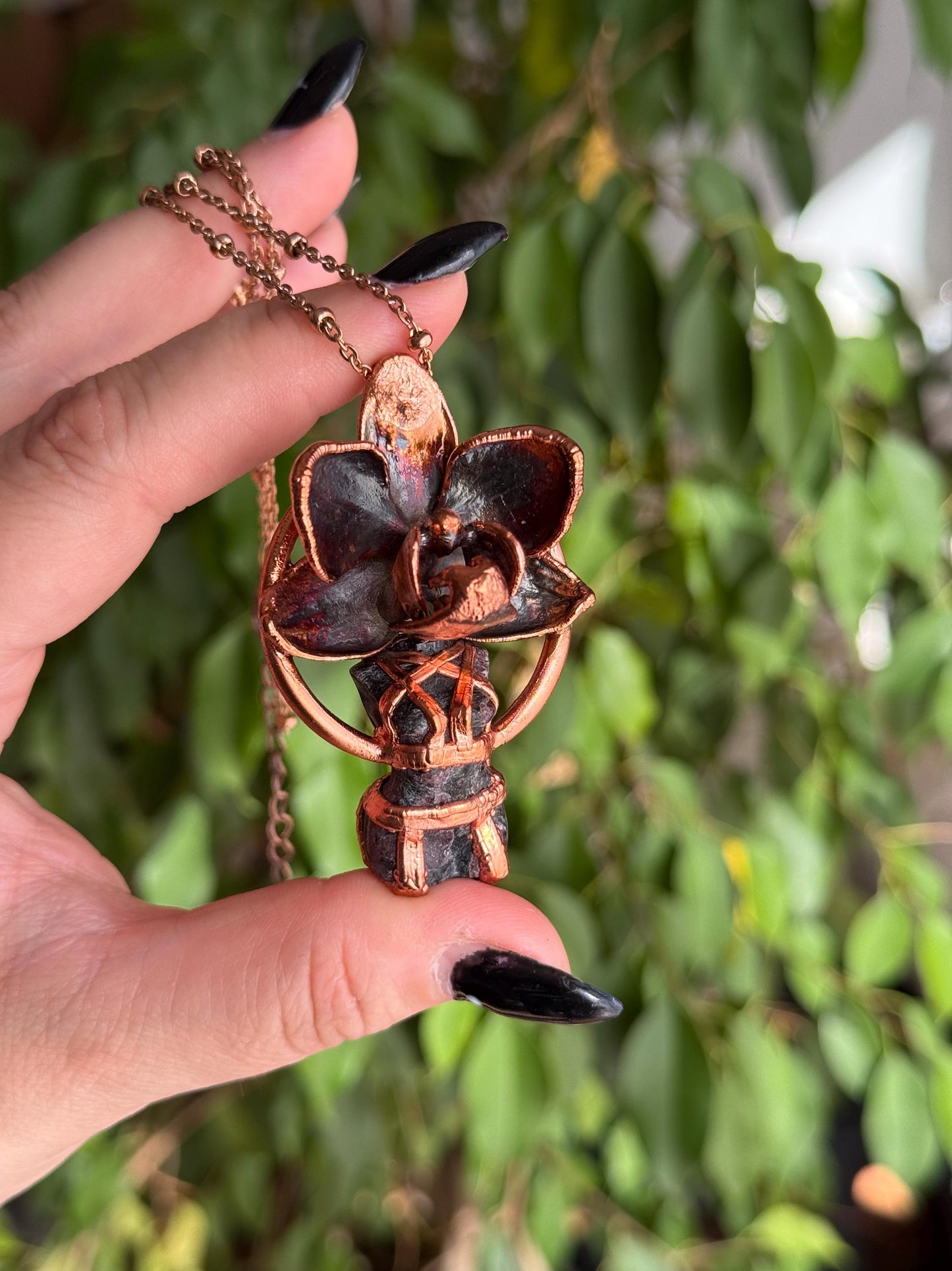 Carved garnet with a real orchid eformed in copper , naughty fairy, delicate necklace on medium chain
