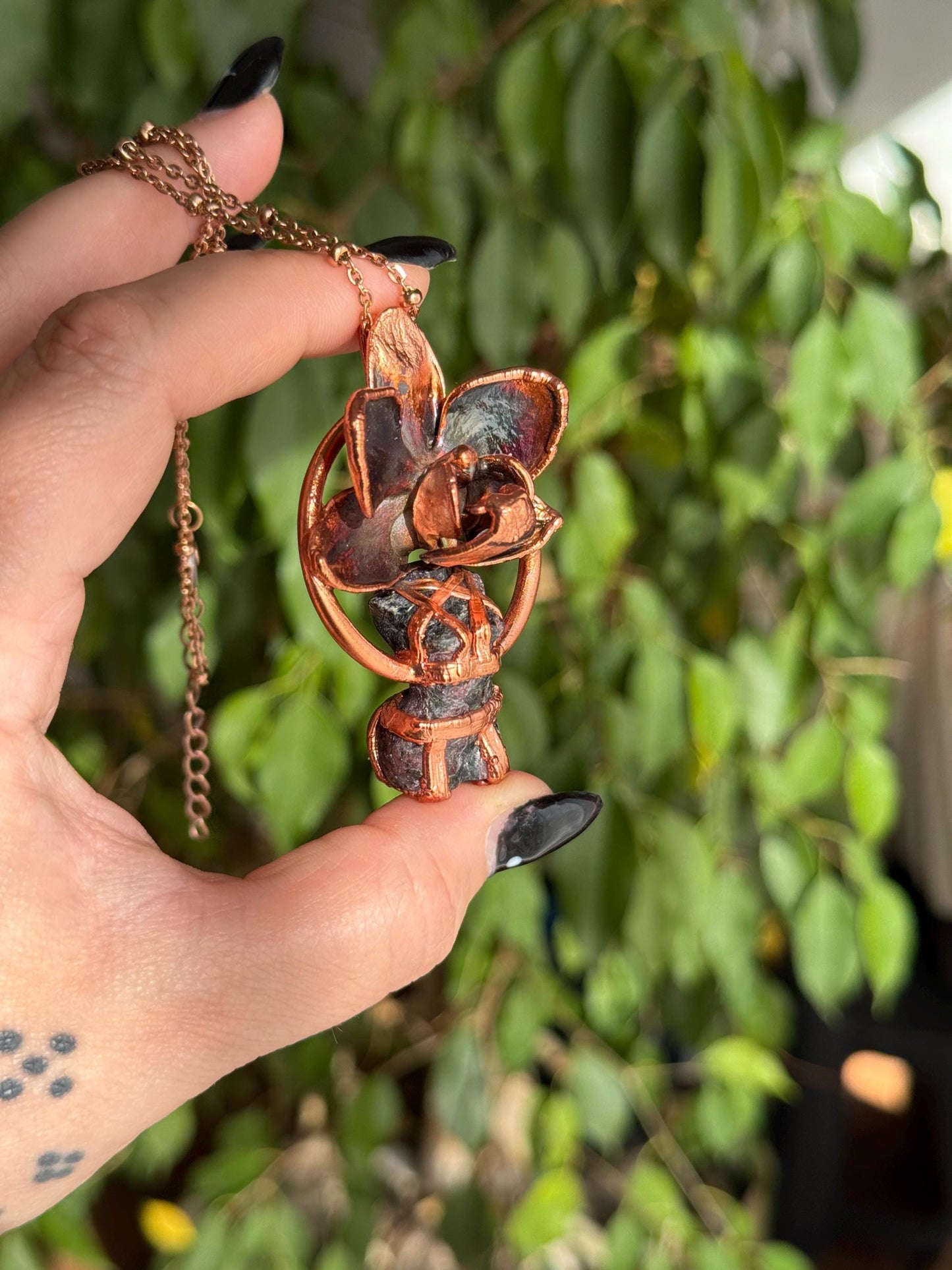 Carved garnet with a real orchid eformed in copper , naughty fairy, delicate necklace on medium chain