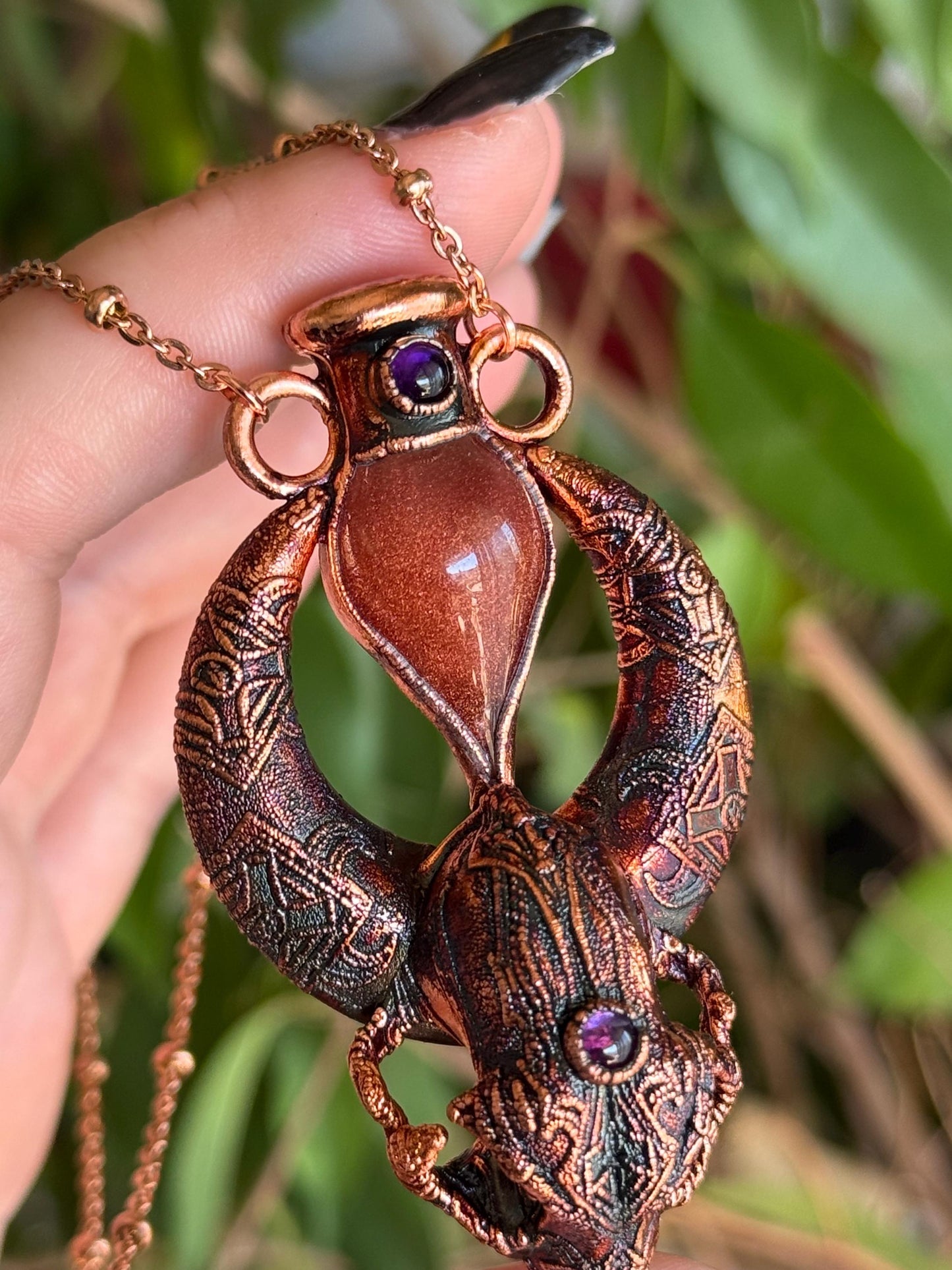 Copper eformed carved resin cat skull with Necronomicon symbols, a magic vial and amethysts on a satellite chain, witchy necklace