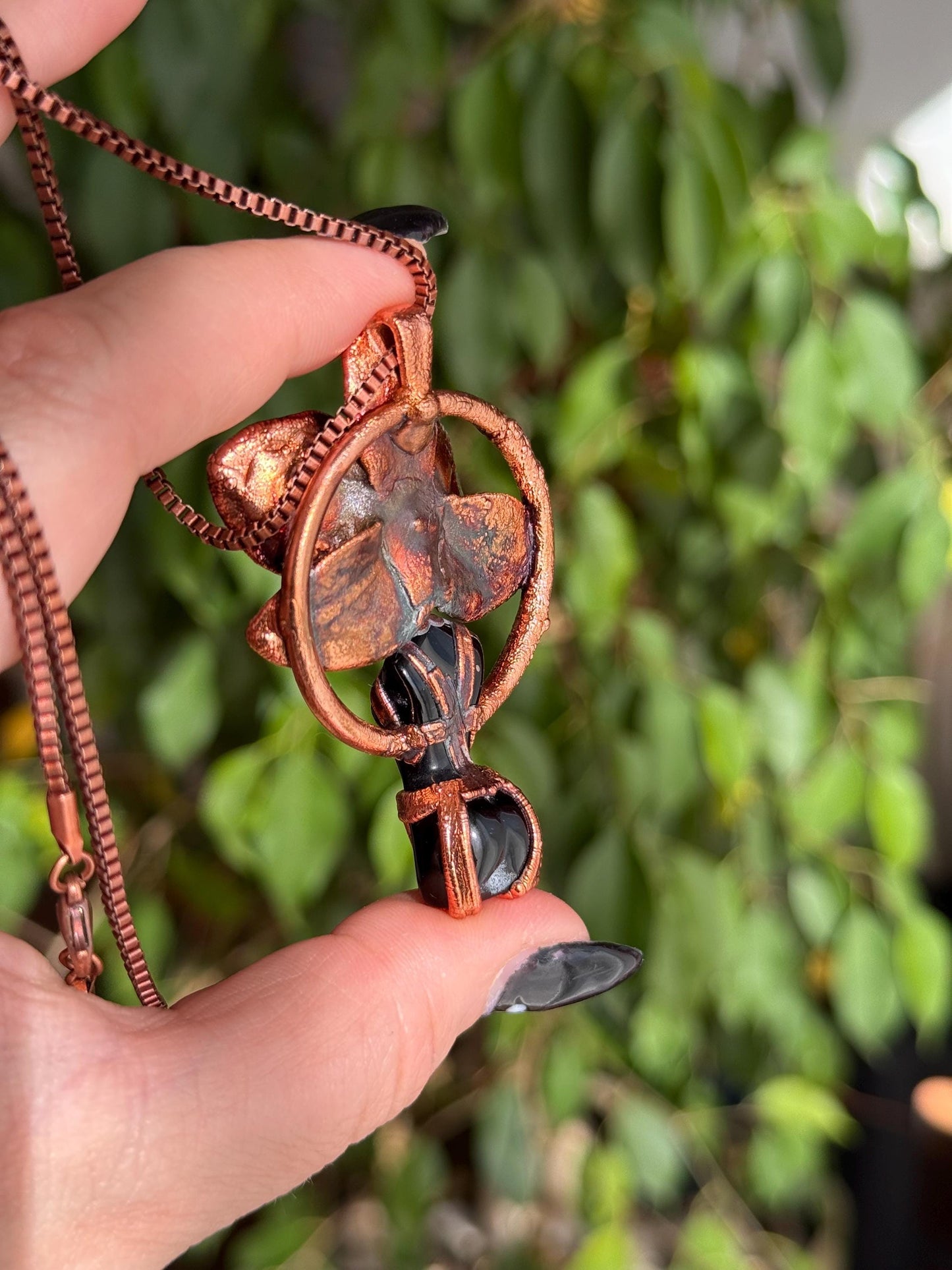 Carved obsidian with a real orchid eformed in copper , naughty fairy, delicate necklace on medium chain