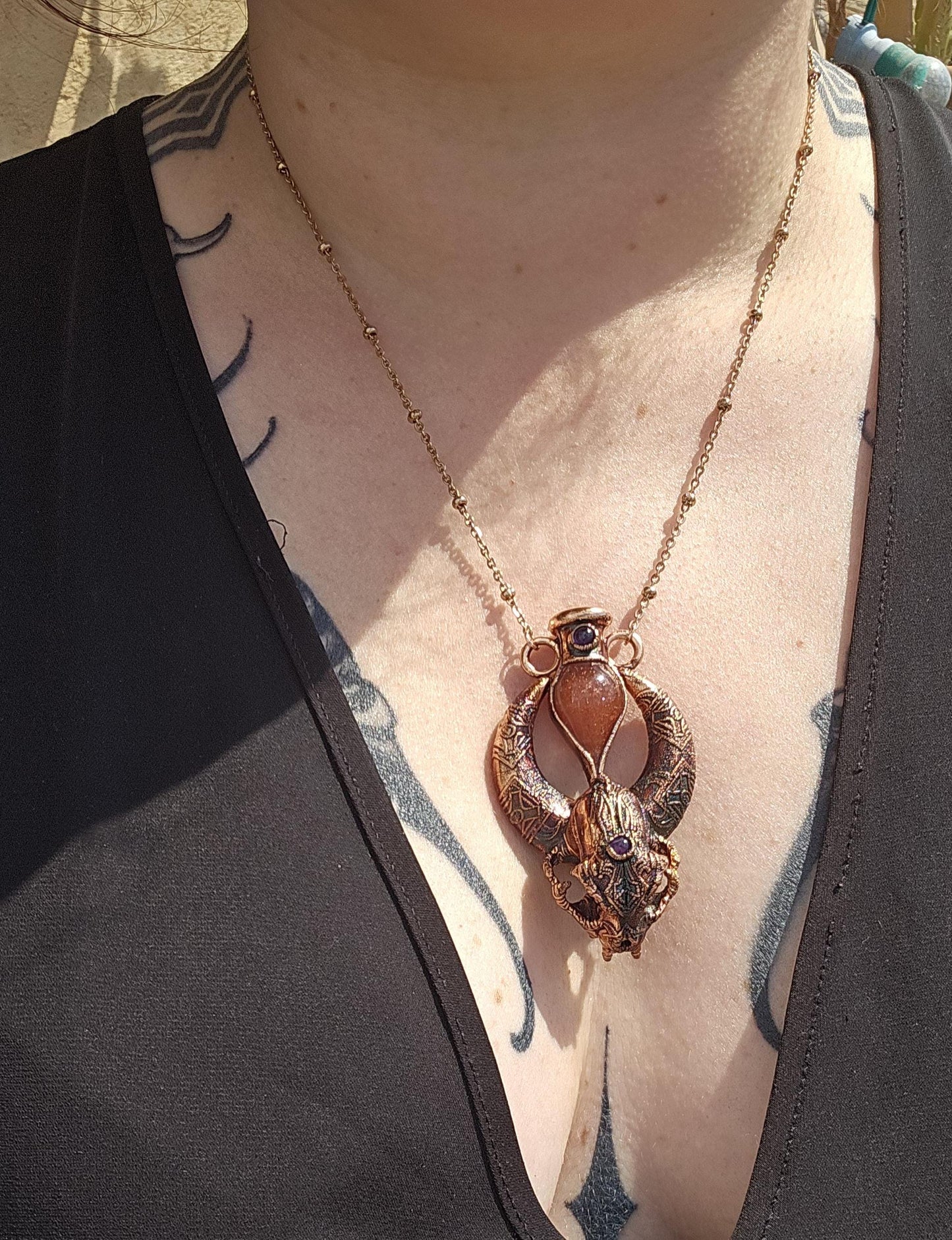 Copper eformed carved resin cat skull with Necronomicon symbols, a magic vial and amethysts on a satellite chain, witchy necklace