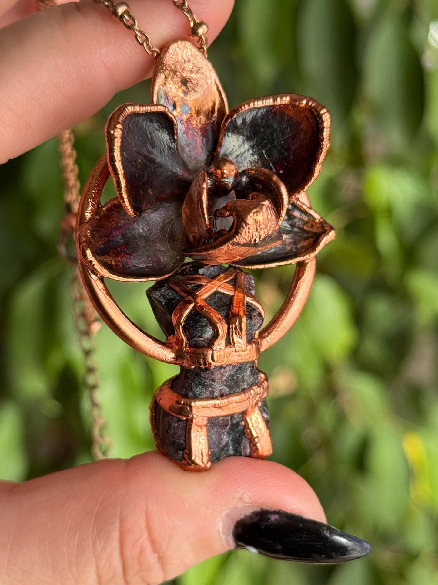Carved garnet with a real orchid eformed in copper , naughty fairy, delicate necklace on medium chain