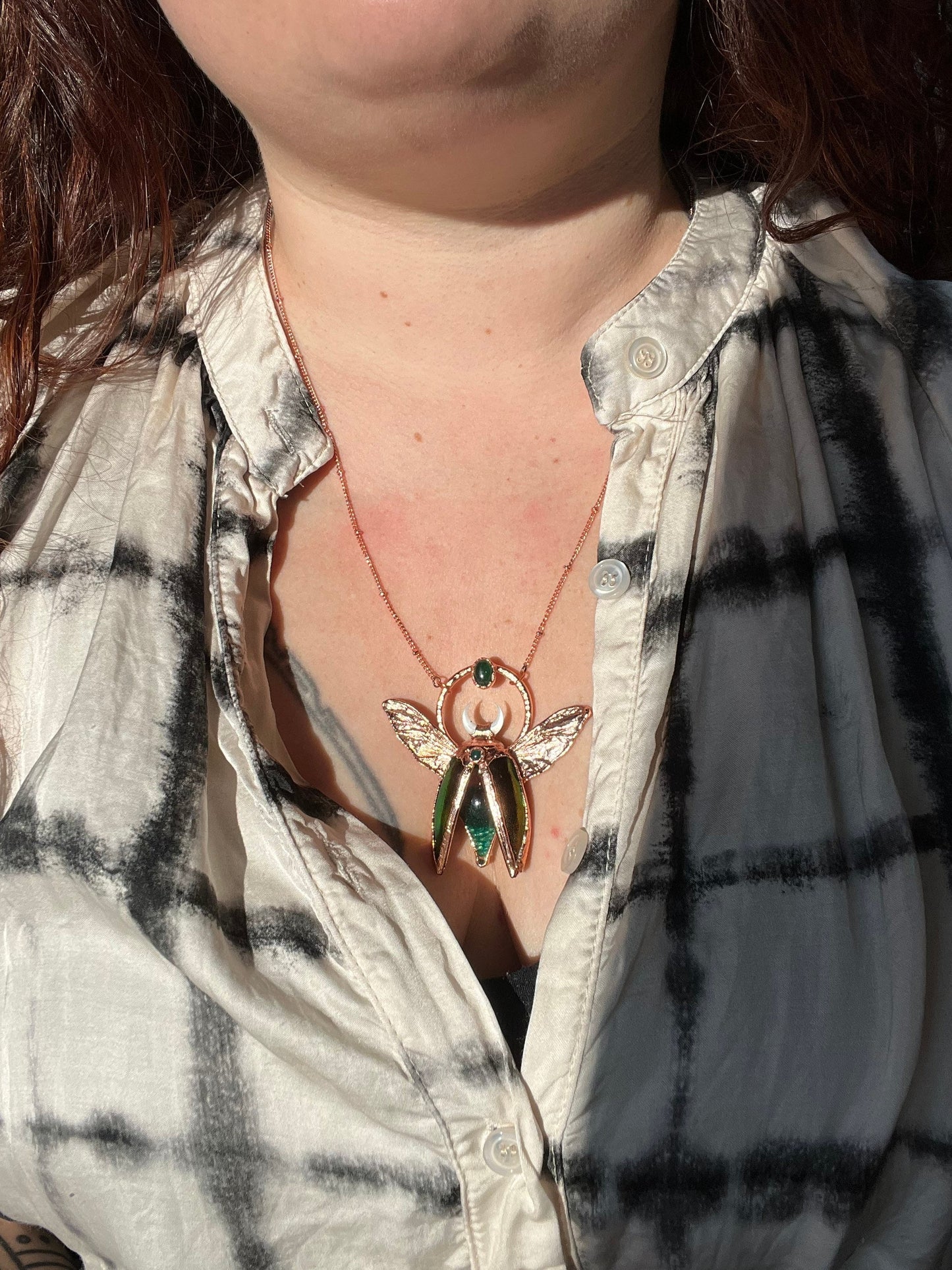 Chimera vial necklace with glittery green water, Copper eformed real beetle wings and elytras with two green onix and a seashell