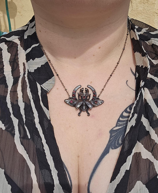 Small stag beetle with garnest on a moon frame, copper eformed necklace, unique piece Egyptian inspired with a dark finish