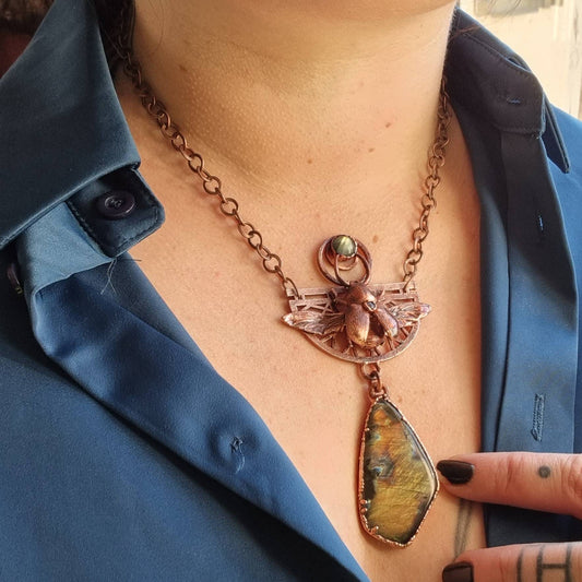 Eformed real stag beetle with a big gorgeous spectrolite labradorite and 2 small labradorites for a very Egyptian inspired  piece