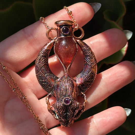 Copper eformed carved resin cat skull with Necronomicon symbols, a magic vial and amethysts on a satellite chain, witchy necklace
