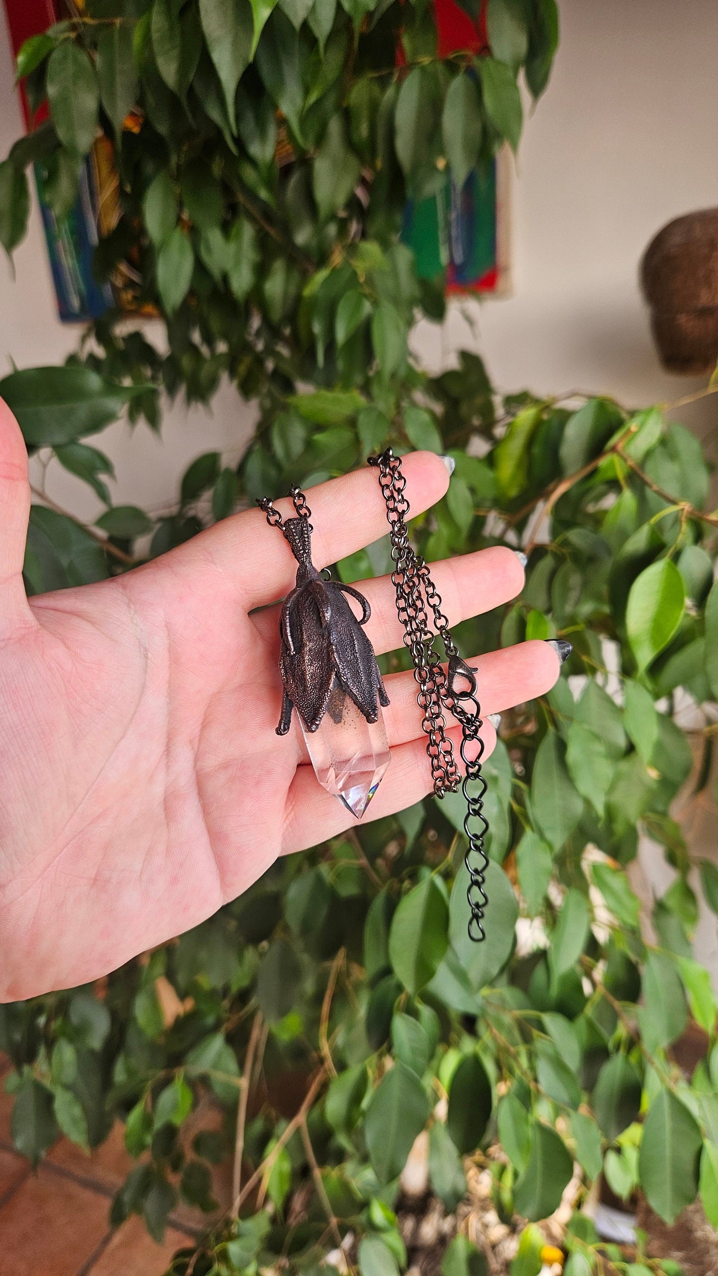 quartz point copper eformed on a real hibiscus bud, with a dark gunblack patina, medium long delicate dark fairy goth necklace
