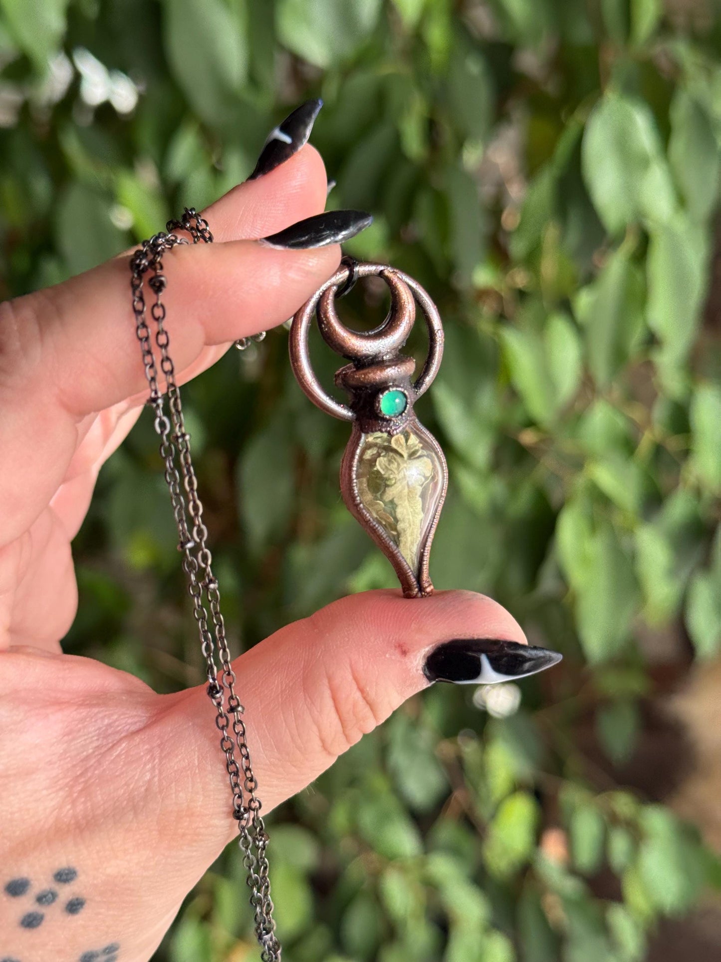 Simple vial filled with fern, Copper eformed necklace with dark finish adorned with a tiny green onix