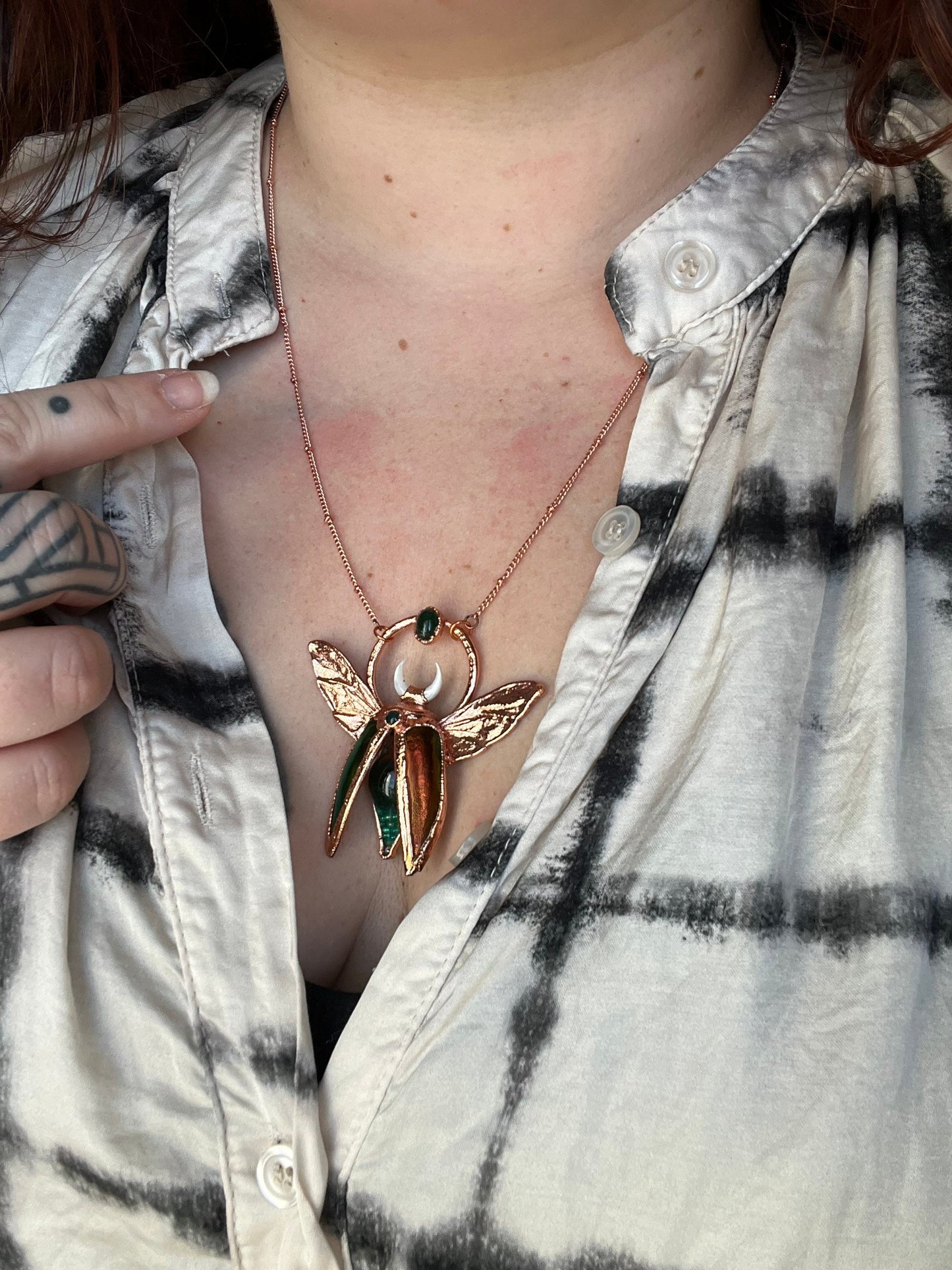 Chimera vial necklace with glittery green water, Copper eformed real beetle wings and elytras with two green onix and a seashell