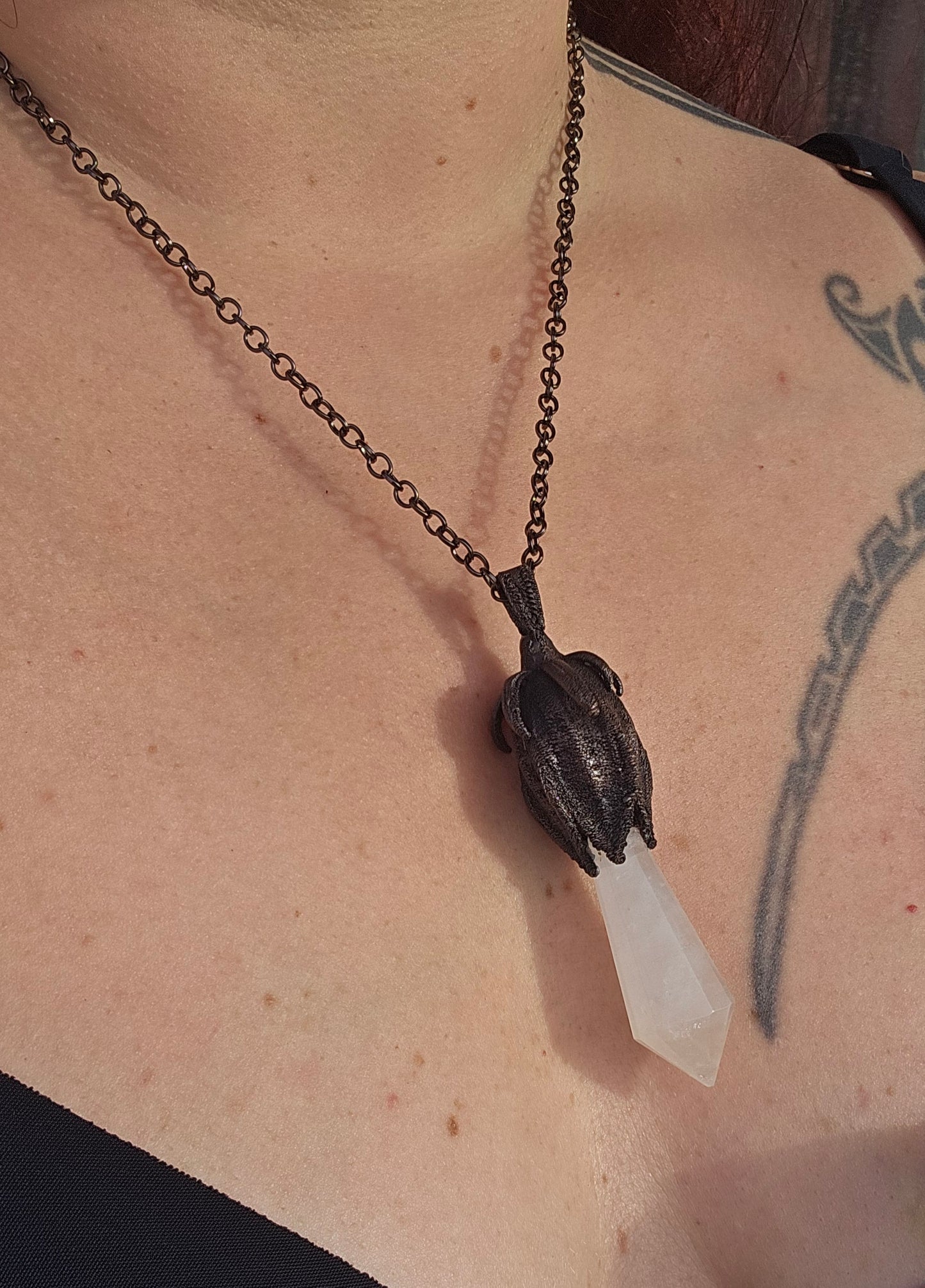 quartz point copper eformed on a real hibiscus bud, with a dark gunblack patina, medium long delicate dark fairy goth necklace
