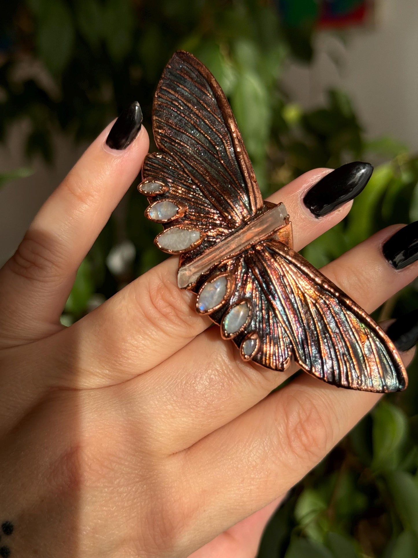 Butterfly ring with a quartz point and moonstones size 5.25 US/uk K, copper eformed with colorful patina