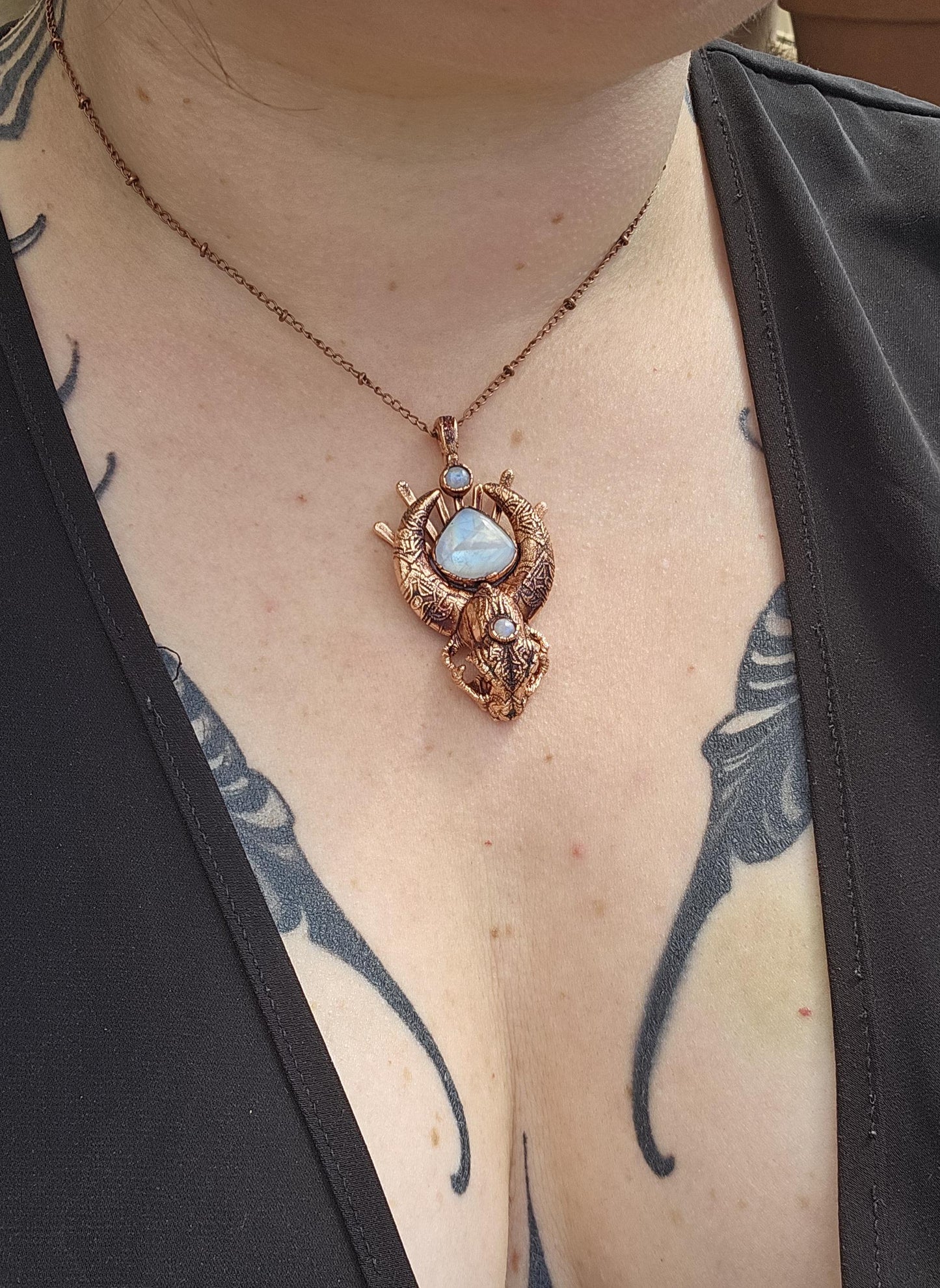 Copper eformed carved resin cat skull with Necronomicon symbols and rainbow moonstones on a satellite chain, witchy necklace