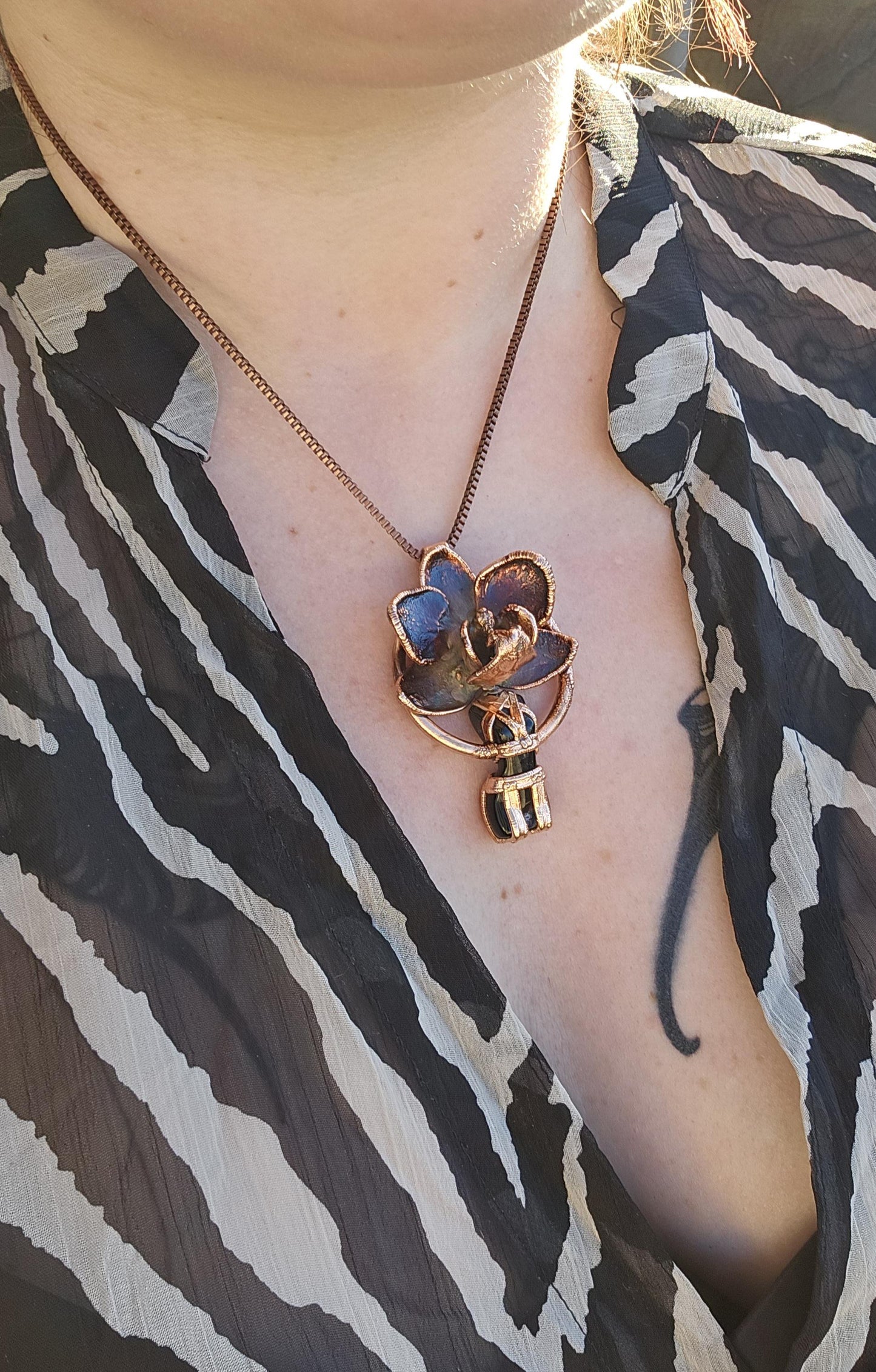 Carved obsidian with a real orchid eformed in copper ,  naughty fairy,  delicate necklace on medium chain