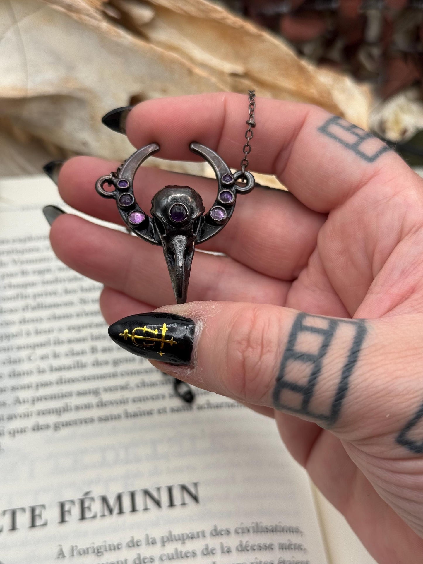 Goth Copper eformed 3d printed raven skull gunblack finish with amethysts on a moon frame, resin vegan skull on a short chain