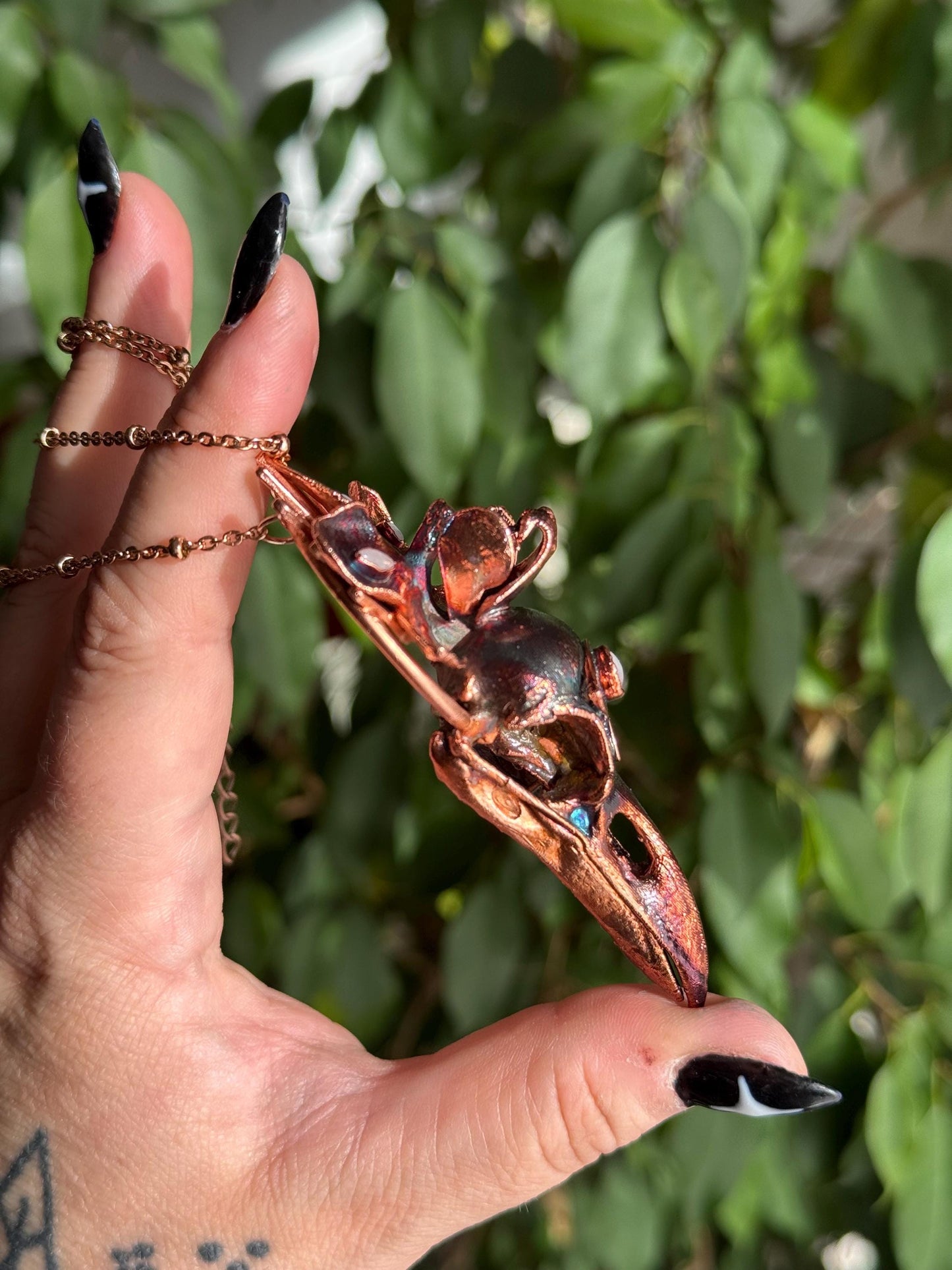 Copper eformed resin raven skull with a real orchid