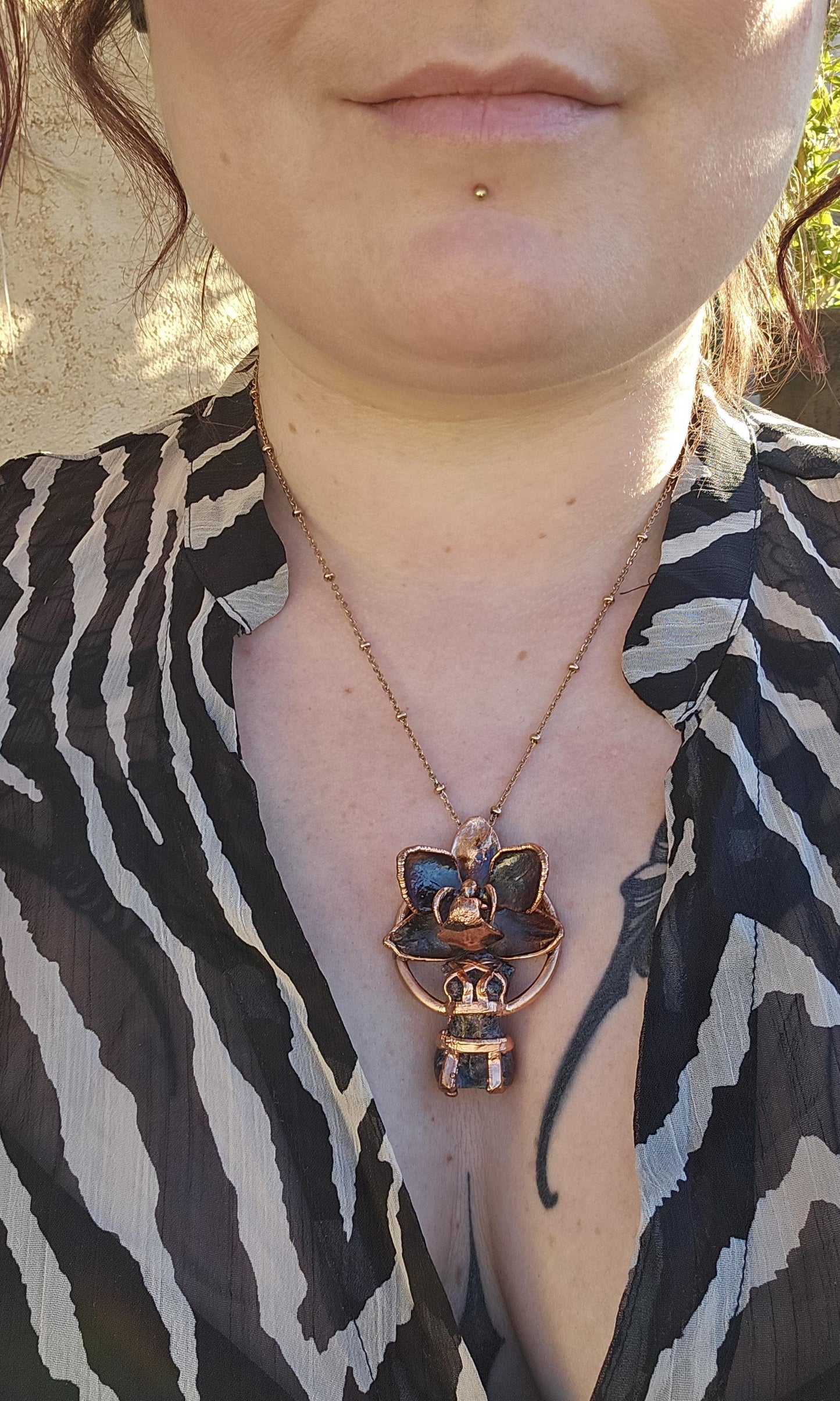 Carved garnet with a real orchid eformed in copper ,  naughty fairy,  delicate necklace on medium chain