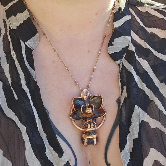 Carved garnet with a real orchid eformed in copper ,  naughty fairy,  delicate necklace on medium chain