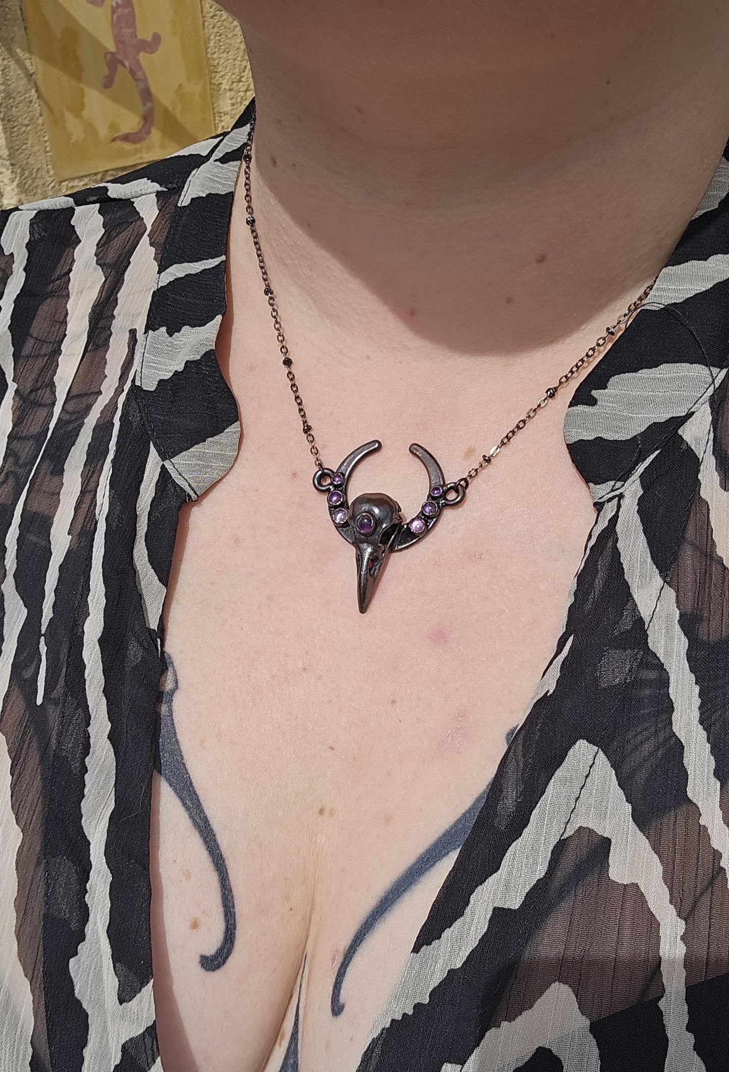 Goth Copper eformed 3d printed raven skull gunblack finish with amethysts on a moon frame, resin vegan skull on a short chain