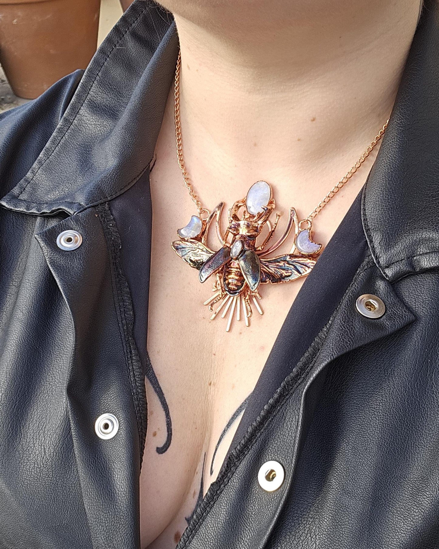 Eformed resin stag beetle with gorgeous rainbow moonstones