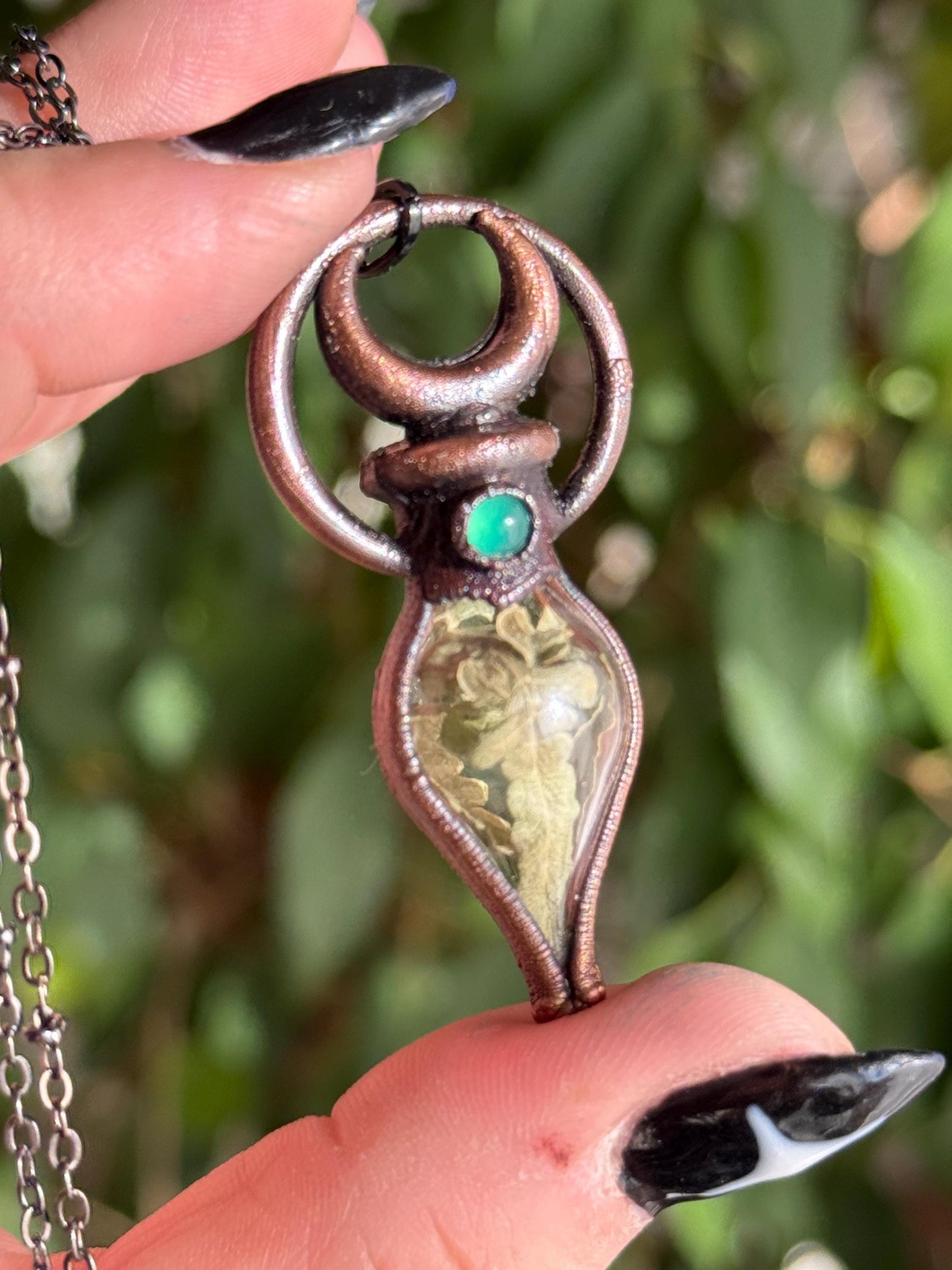 Simple vial filled with fern, Copper eformed necklace with dark finish adorned with a tiny green onix