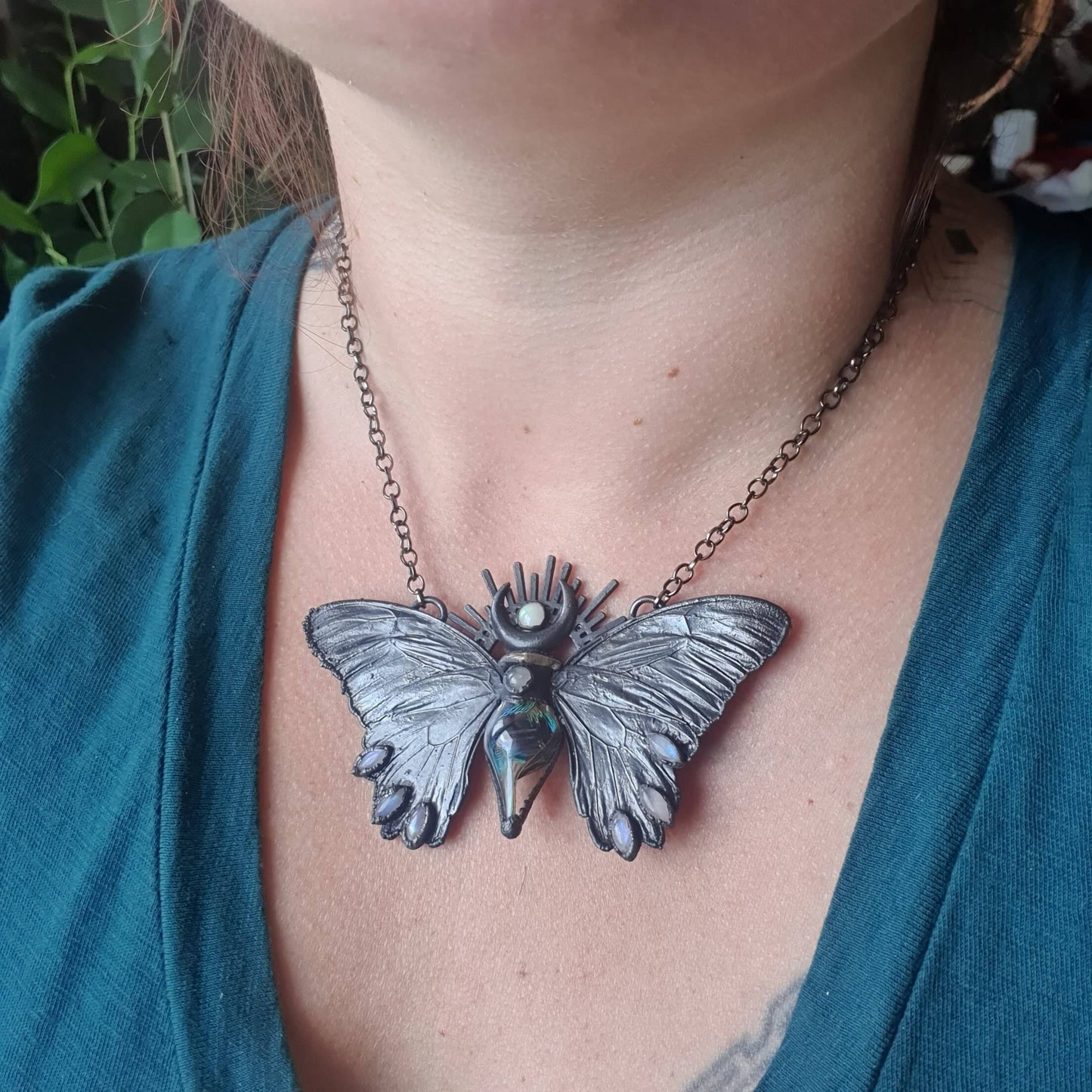 Fairy vial with a peacock feather in it, real eformed butterfly wings and cute moonstones, gunblack patinated short necklace