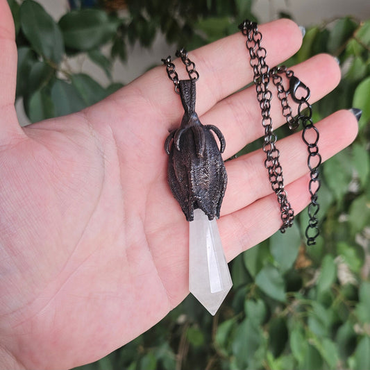 quartz point copper eformed on a real hibiscus bud, with a dark gunblack patina, medium long delicate dark fairy goth necklace