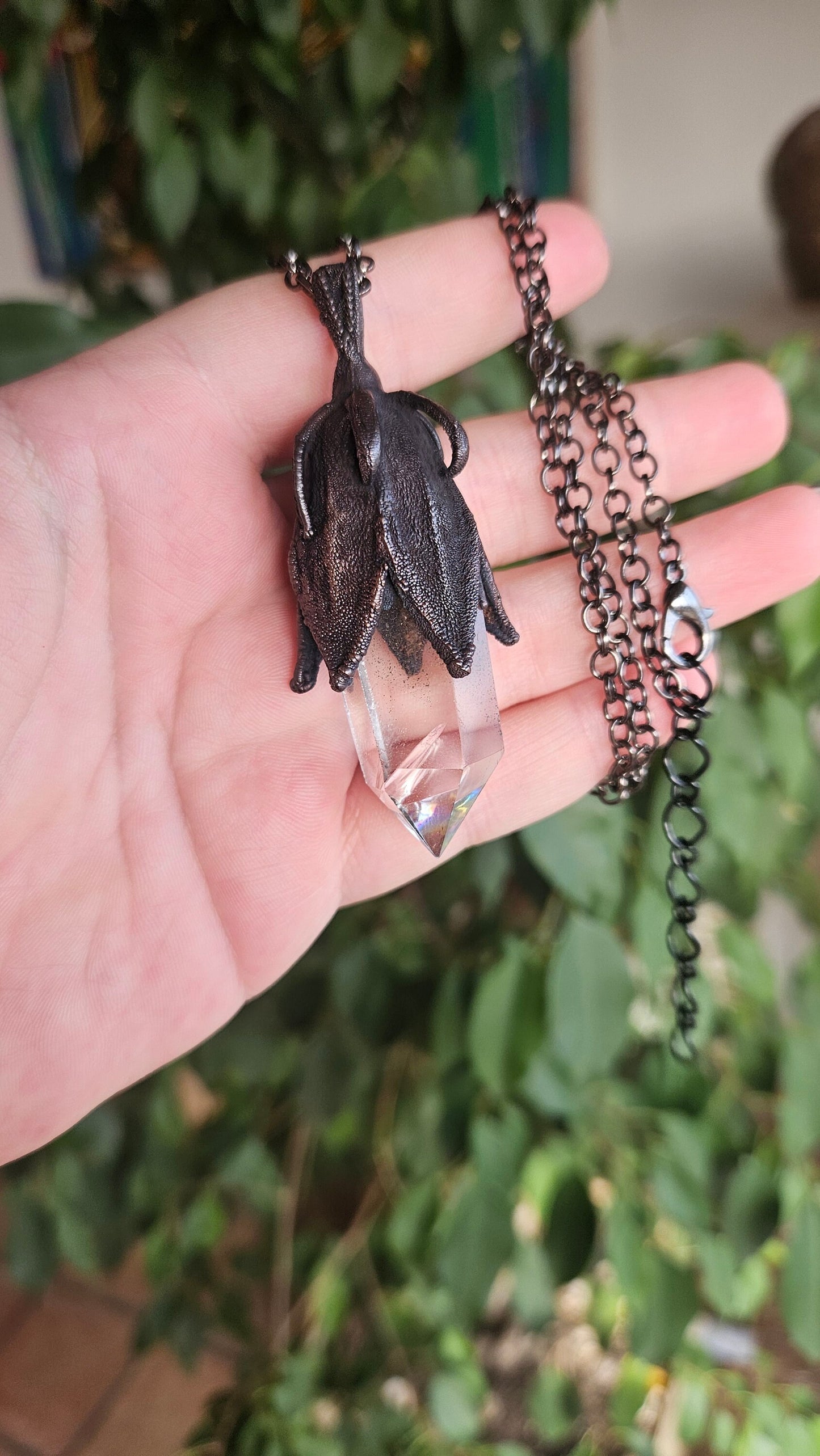 quartz point copper eformed on a real hibiscus bud, with a dark gunblack patina, medium long delicate dark fairy goth necklace