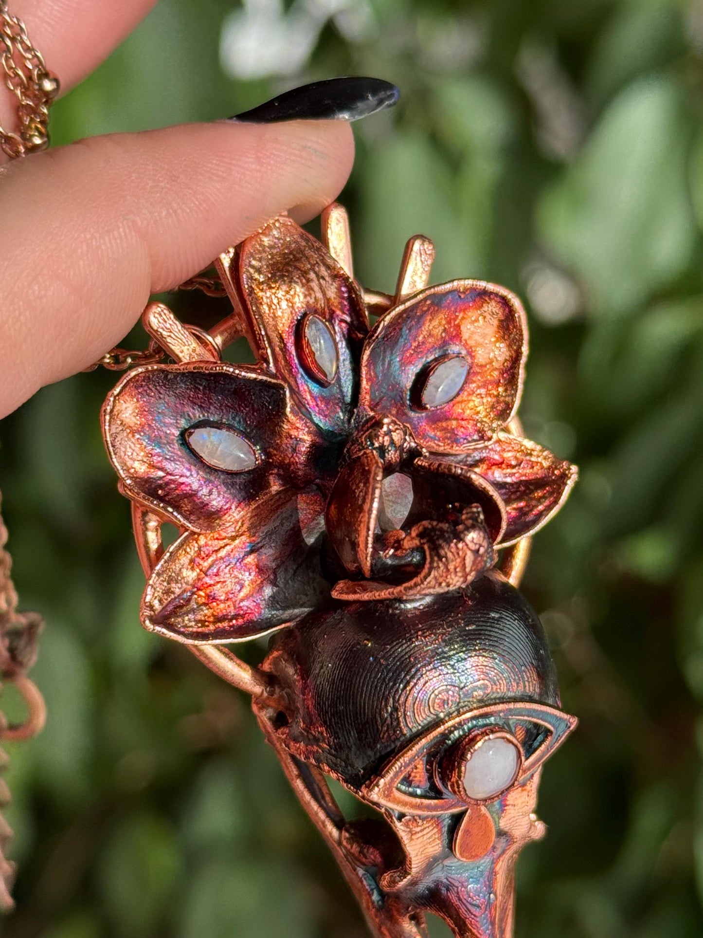 Copper eformed resin raven skull with a real orchid