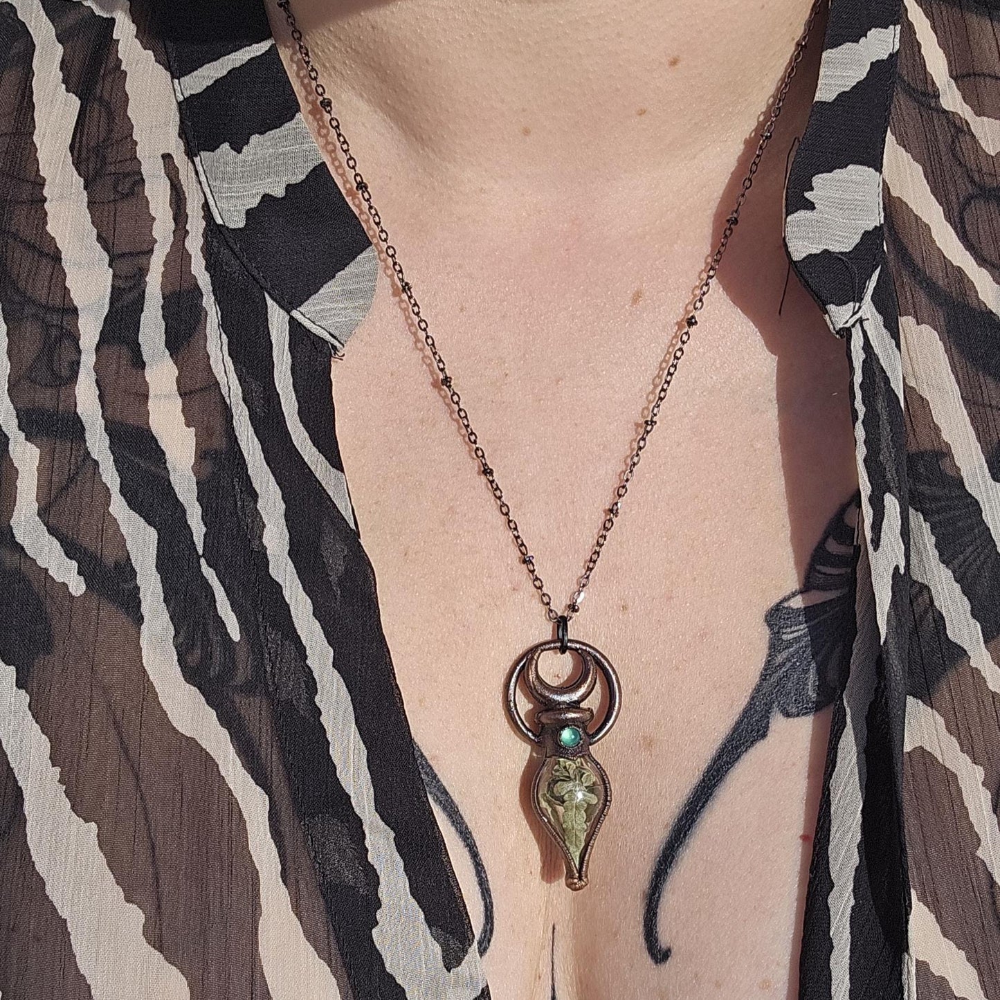 Simple vial filled with fern, Copper eformed necklace with dark finish adorned with a tiny green onix