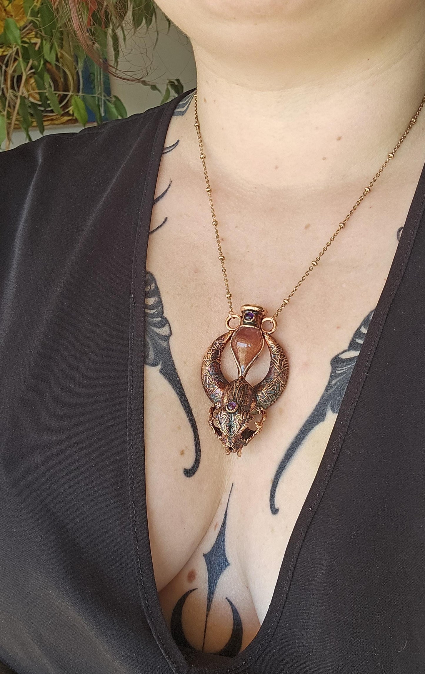 Copper eformed carved resin cat skull with Necronomicon symbols, a magic vial and amethysts on a satellite chain, witchy necklace
