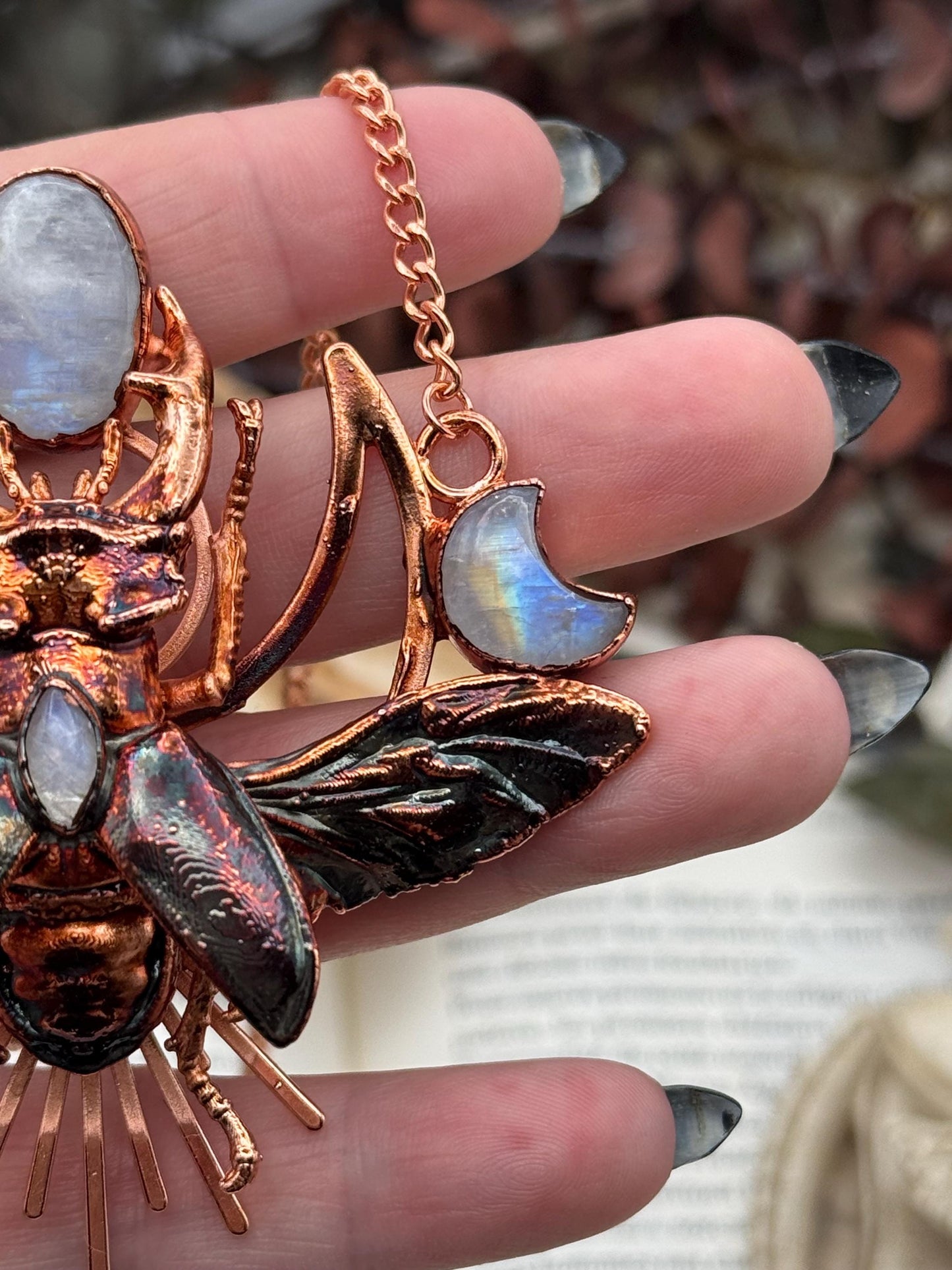 Eformed resin stag beetle with gorgeous rainbow moonstones