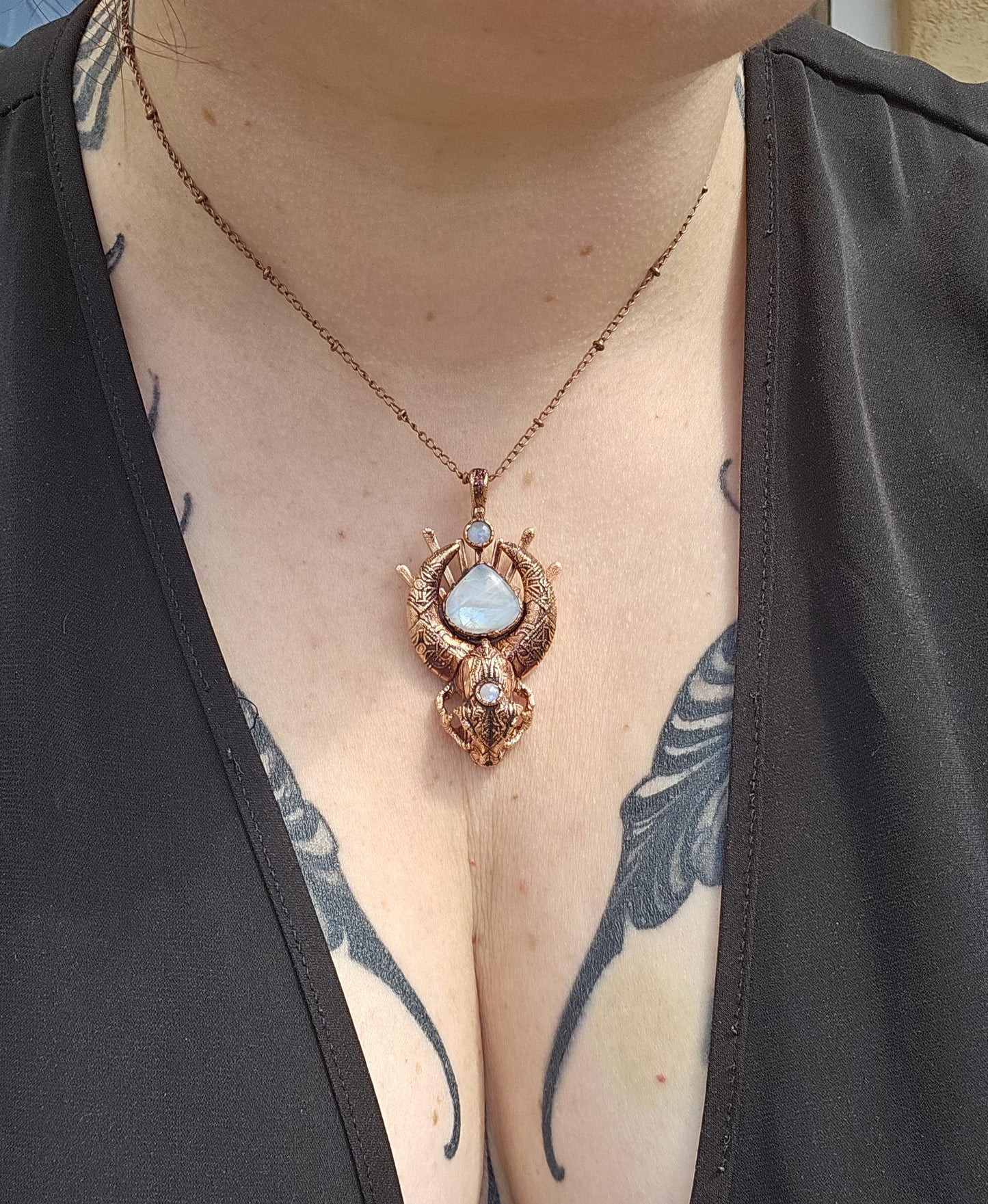 Copper eformed carved resin cat skull with Necronomicon symbols and rainbow moonstones on a satellite chain, witchy necklace