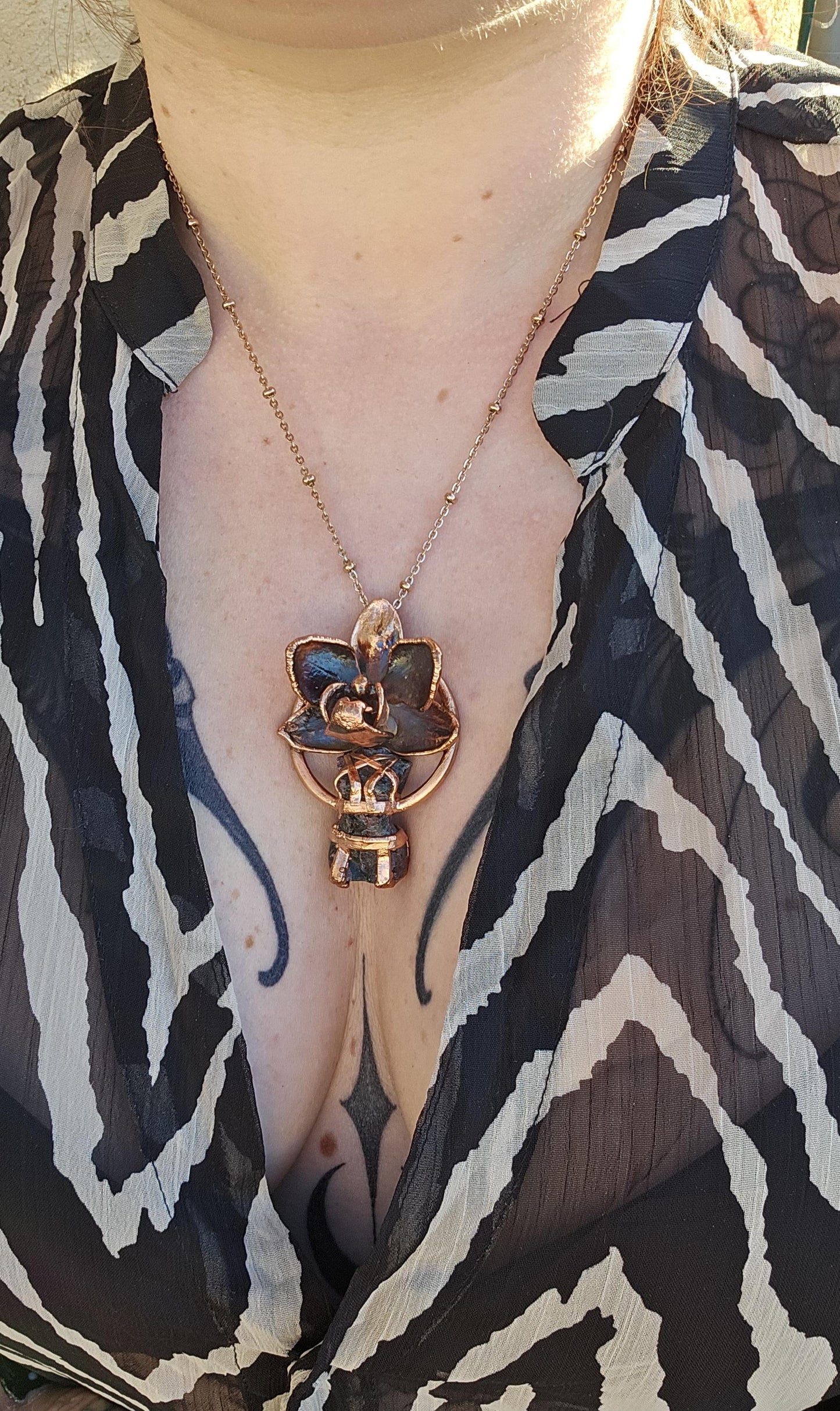 Carved garnet with a real orchid eformed in copper ,  naughty fairy,  delicate necklace on medium chain