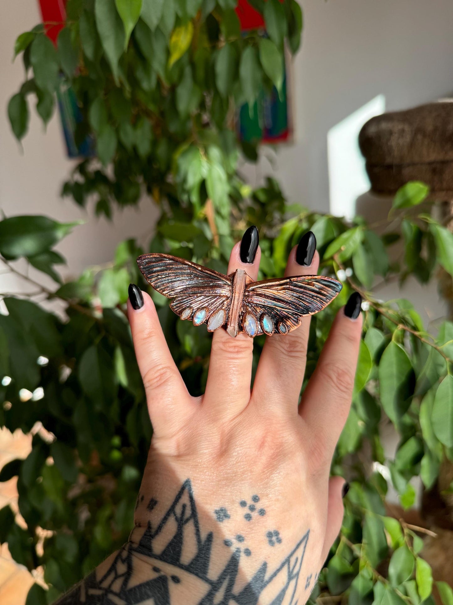 Butterfly ring with a quartz point and moonstones size 5.25 US/uk K, copper eformed with colorful patina