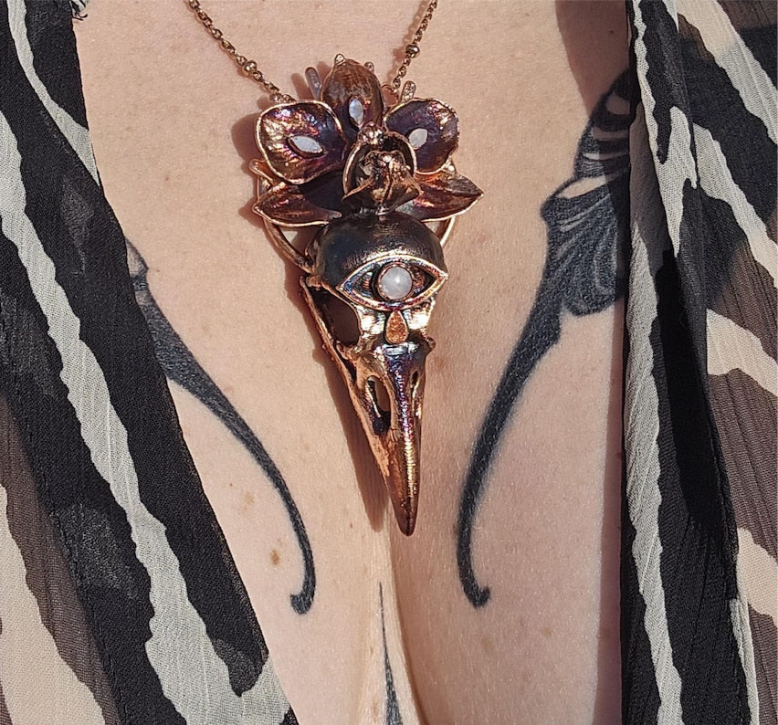 Copper eformed resin raven skull with a real orchid
