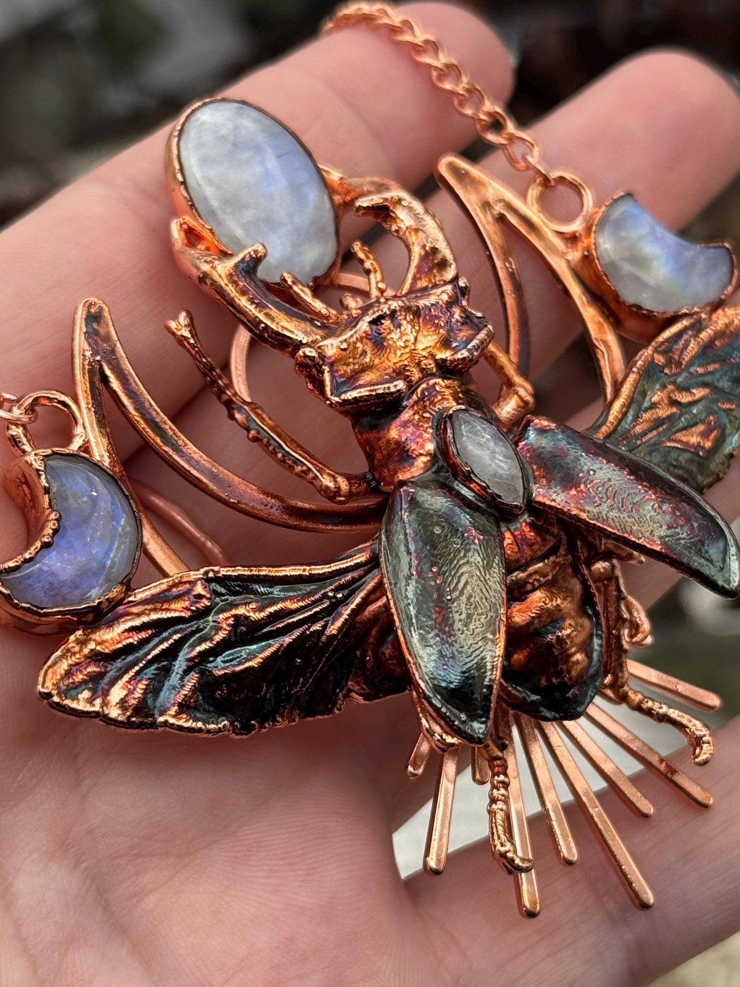 Eformed resin stag beetle with gorgeous rainbow moonstones