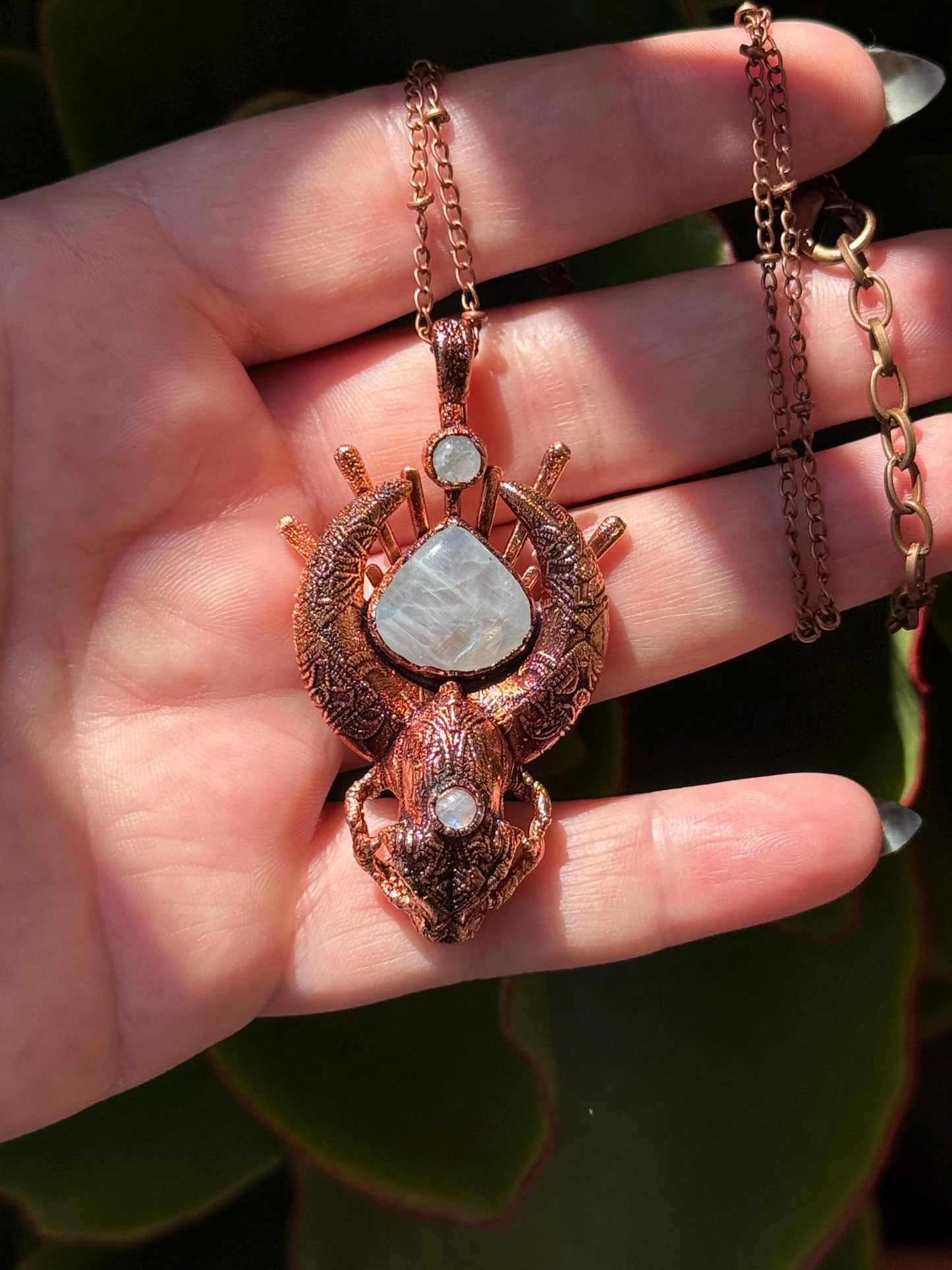 Copper eformed carved resin cat skull with Necronomicon symbols and rainbow moonstones on a satellite chain, witchy necklace