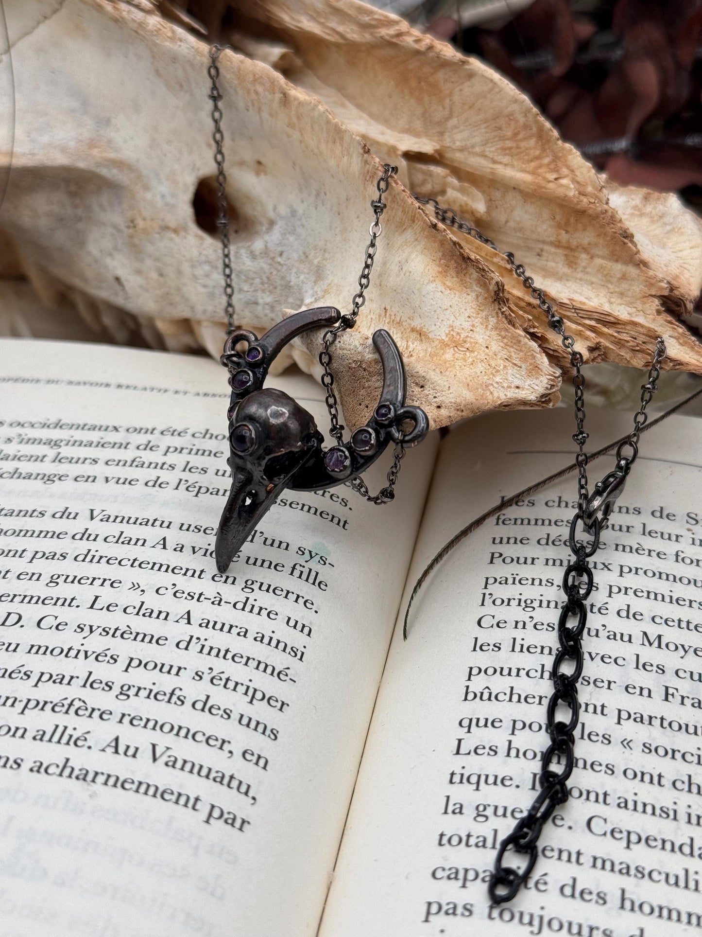Goth Copper eformed 3d printed raven skull gunblack finish with amethysts on a moon frame, resin vegan skull on a short chain