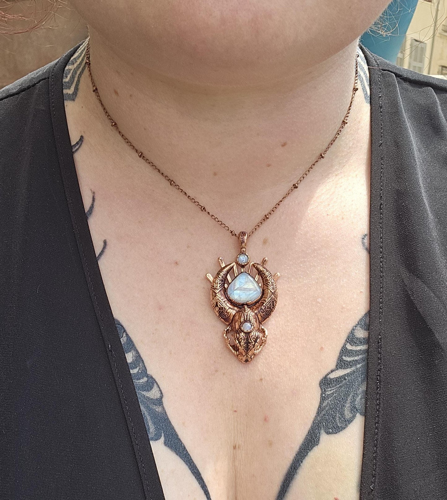 Copper eformed carved resin cat skull with Necronomicon symbols and rainbow moonstones on a satellite chain, witchy necklace