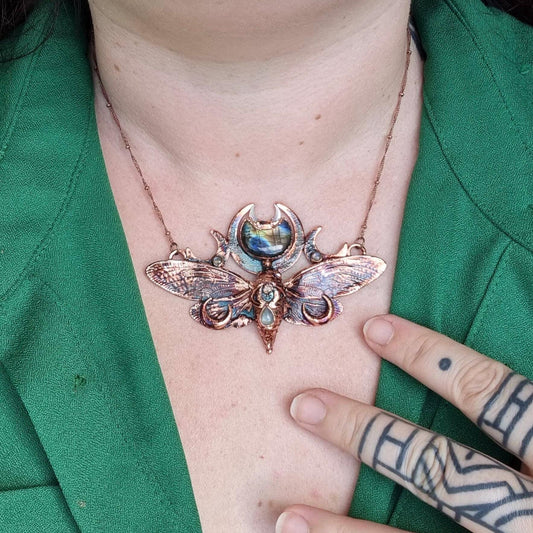 Copper eformed real cicada with a light blue faceted labradorite, two small abalone shell cabs and a small labradorite, gorgeous fairy piece