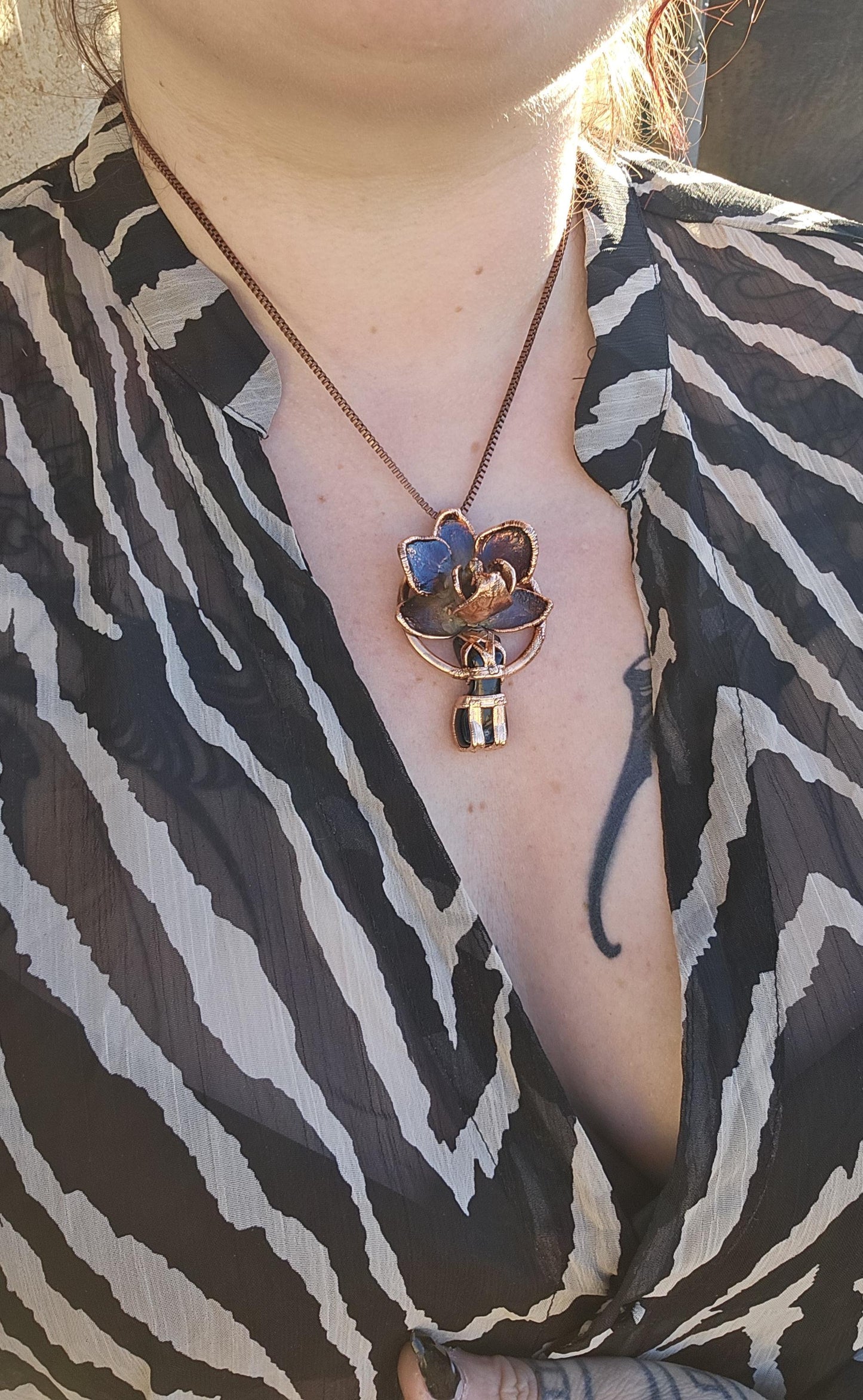 Carved obsidian with a real orchid eformed in copper ,  naughty fairy,  delicate necklace on medium chain
