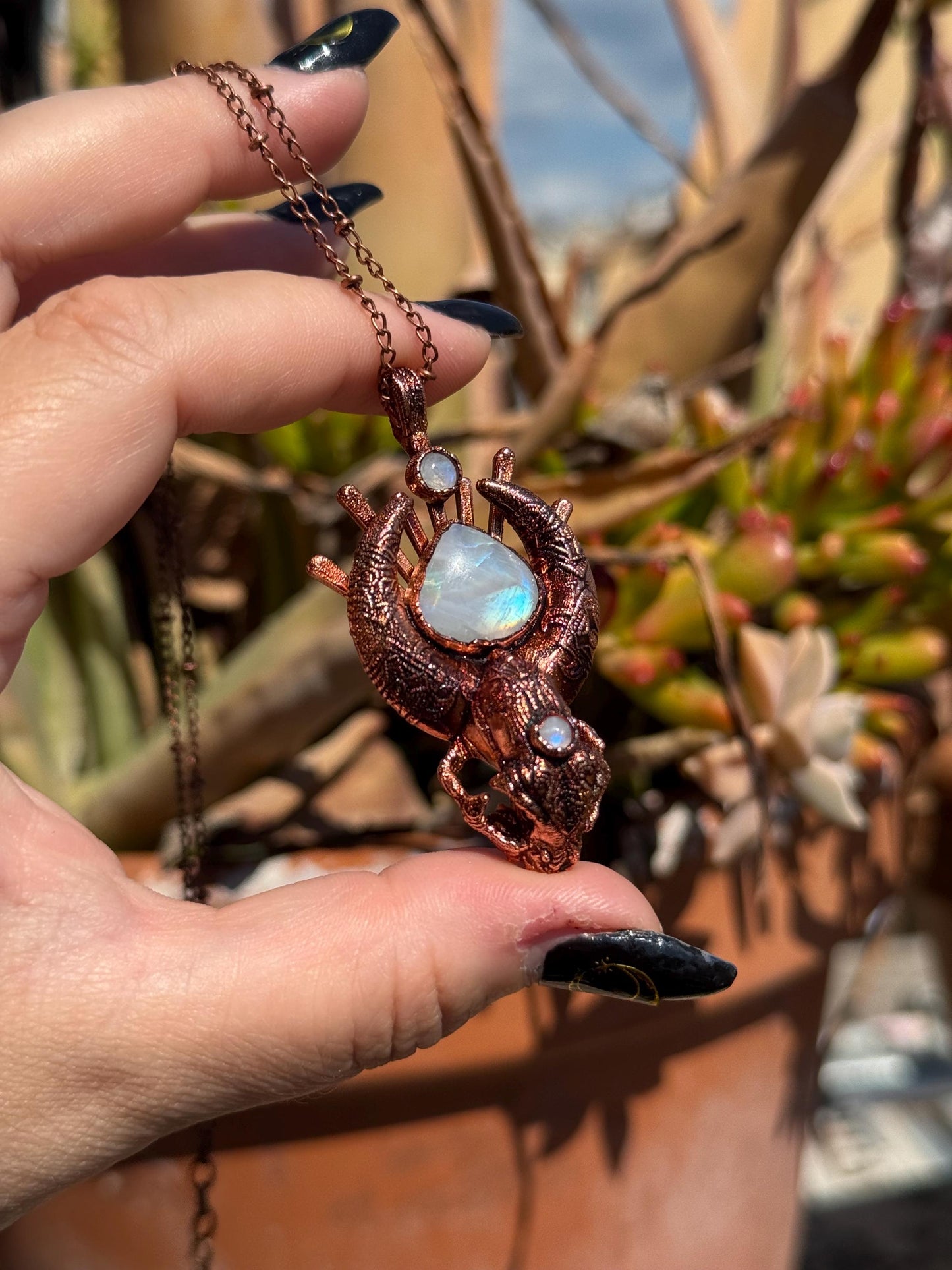 Copper eformed carved resin cat skull with Necronomicon symbols and rainbow moonstones on a satellite chain, witchy necklace