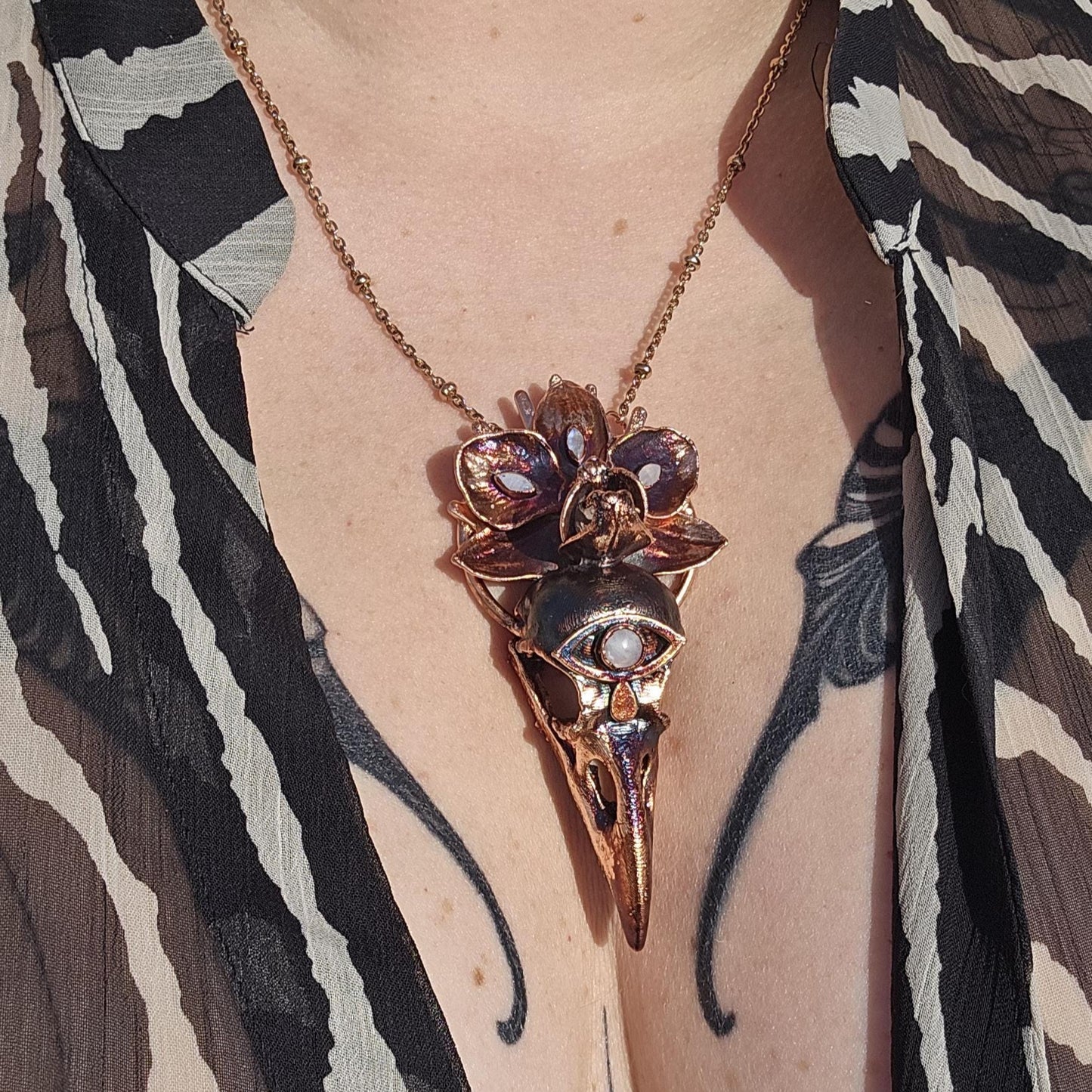 Copper eformed resin raven skull with a real orchid