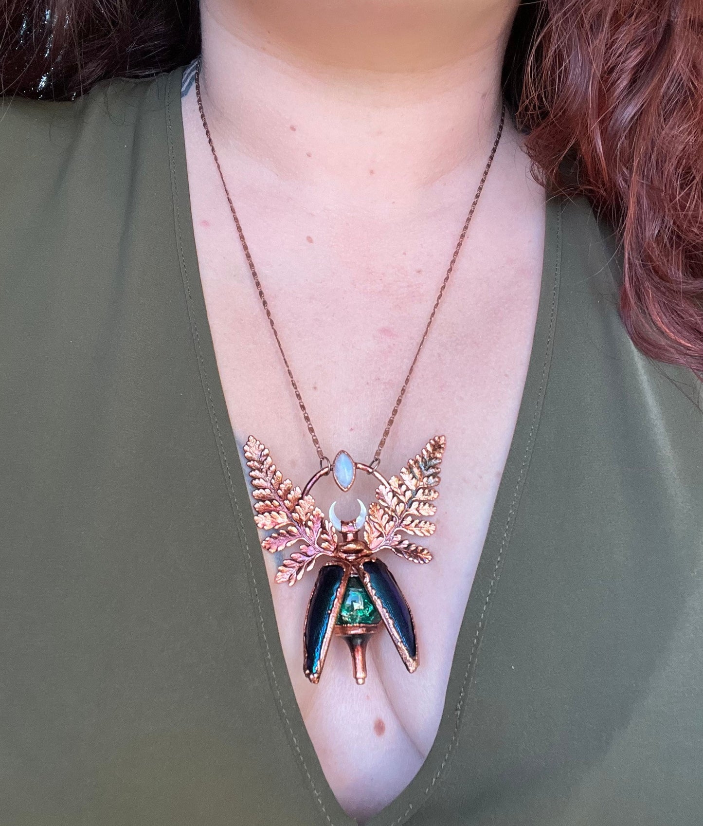 Chimera vial necklace with glittery green water, Copper eformed real beetle elytras with ferns wings, a rainbow moonstone and a white moon