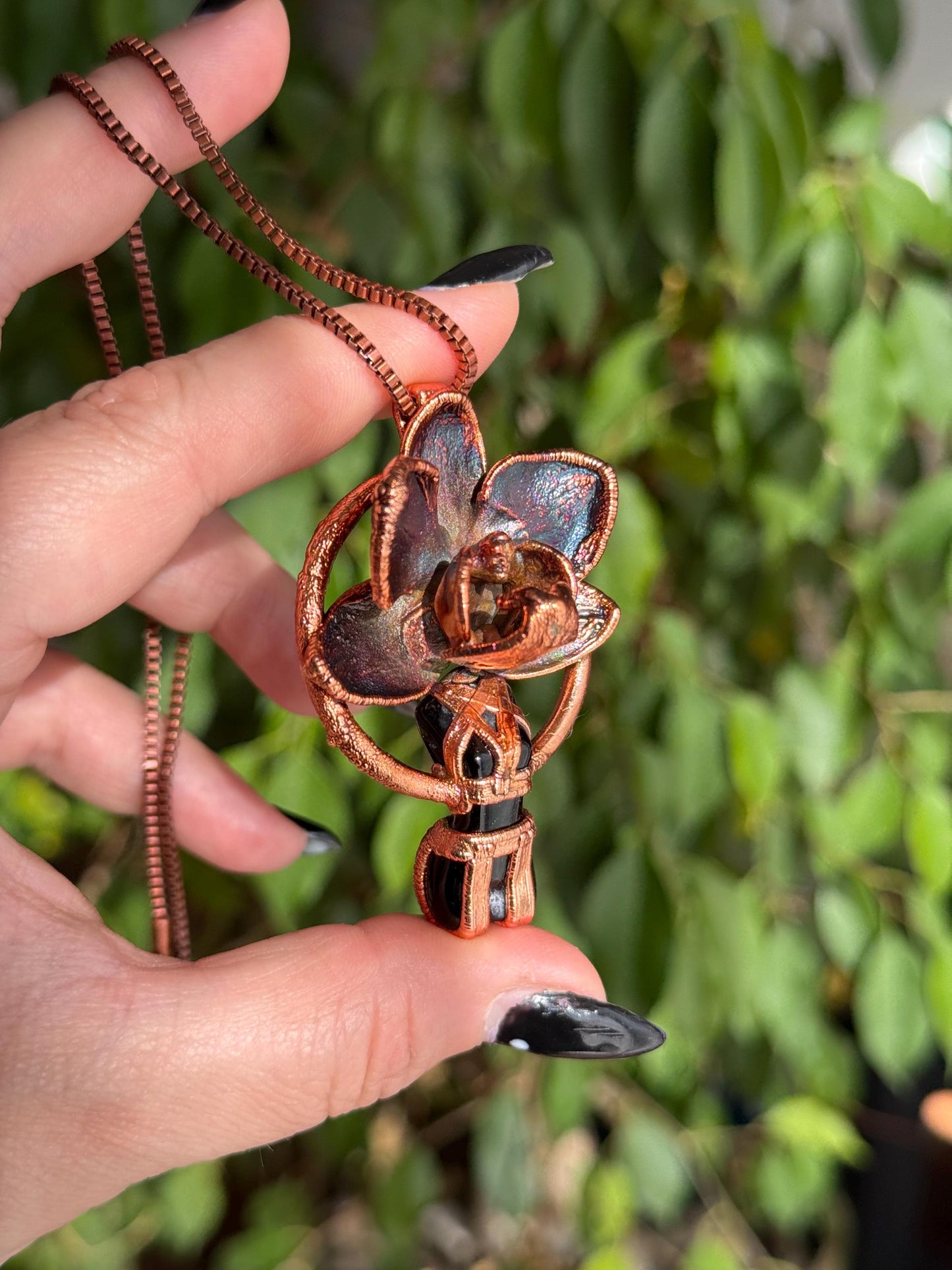 Carved obsidian with a real orchid eformed in copper ,  naughty fairy,  delicate necklace on medium chain