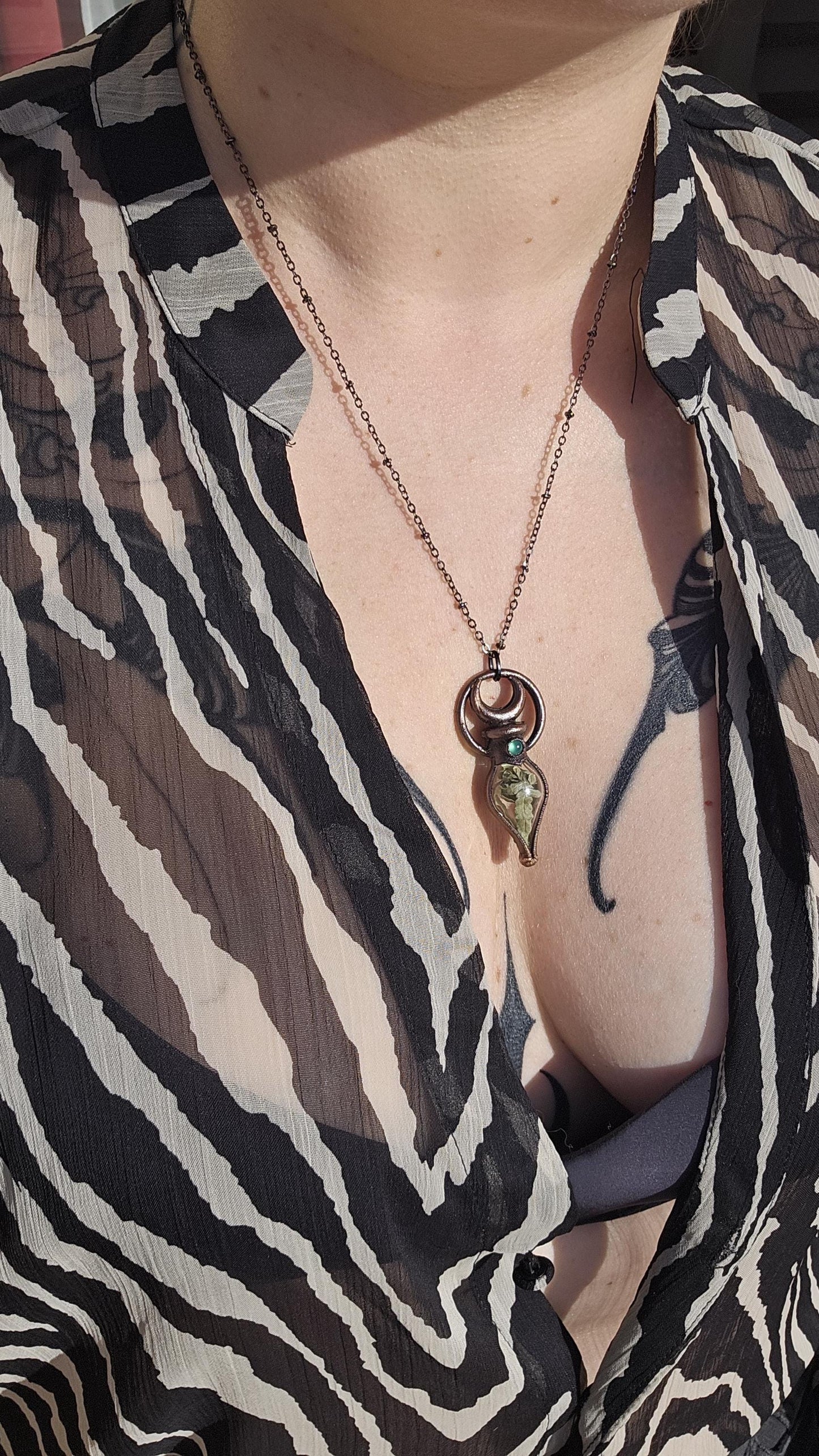Simple vial filled with fern, Copper eformed necklace with dark finish adorned with a tiny green onix