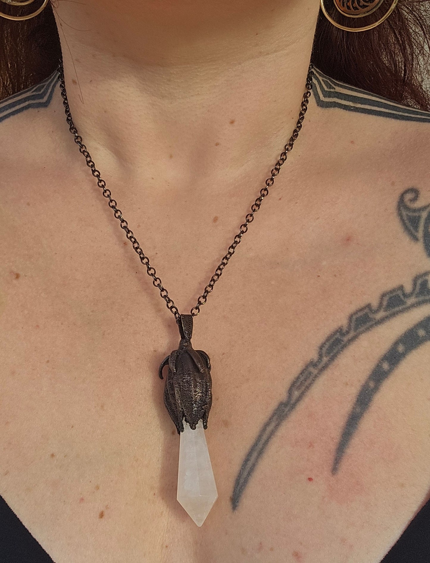 quartz point copper eformed on a real hibiscus bud, with a dark gunblack patina, medium long delicate dark fairy goth necklace