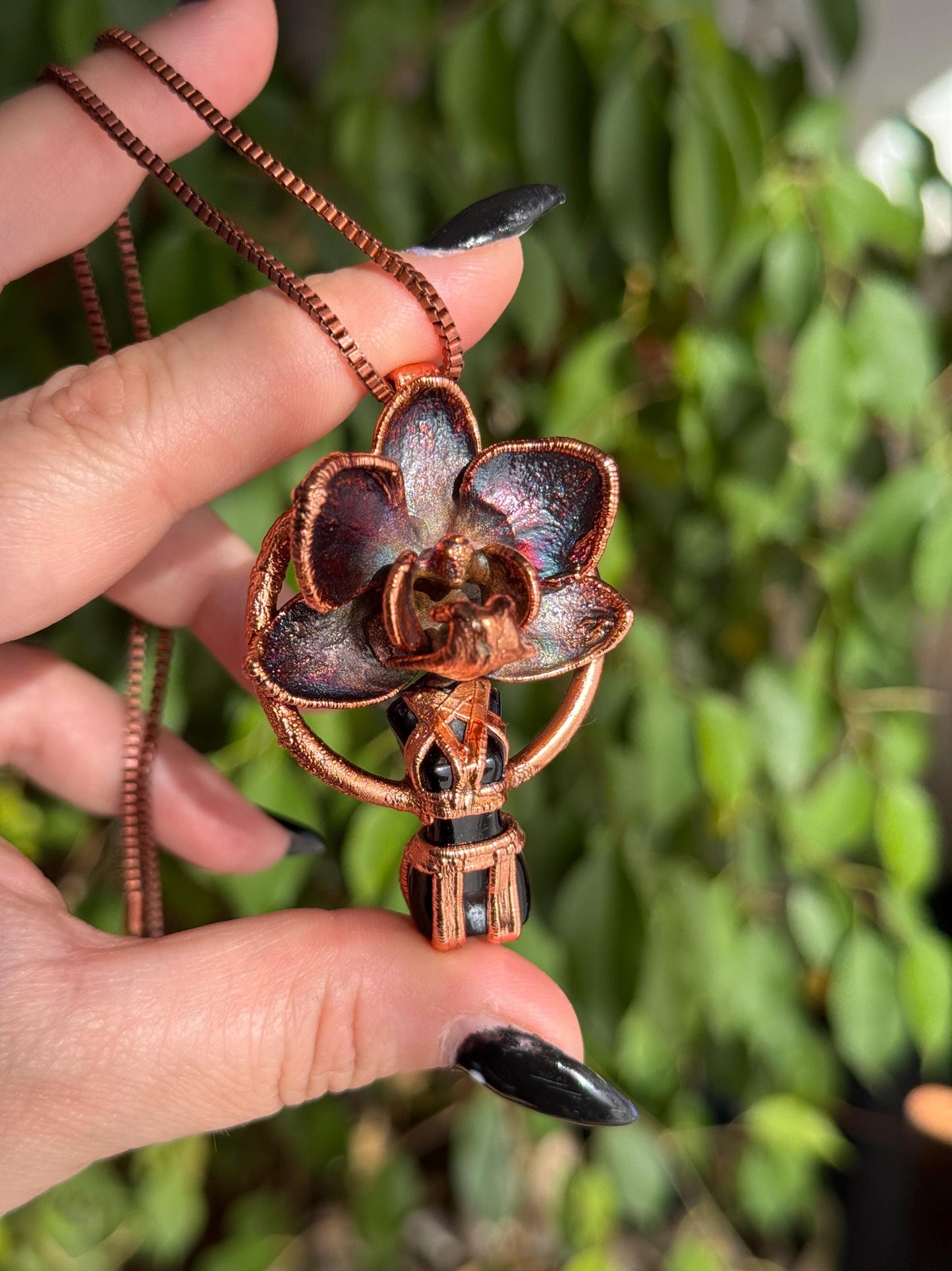 Carved obsidian with a real orchid eformed in copper ,  naughty fairy,  delicate necklace on medium chain