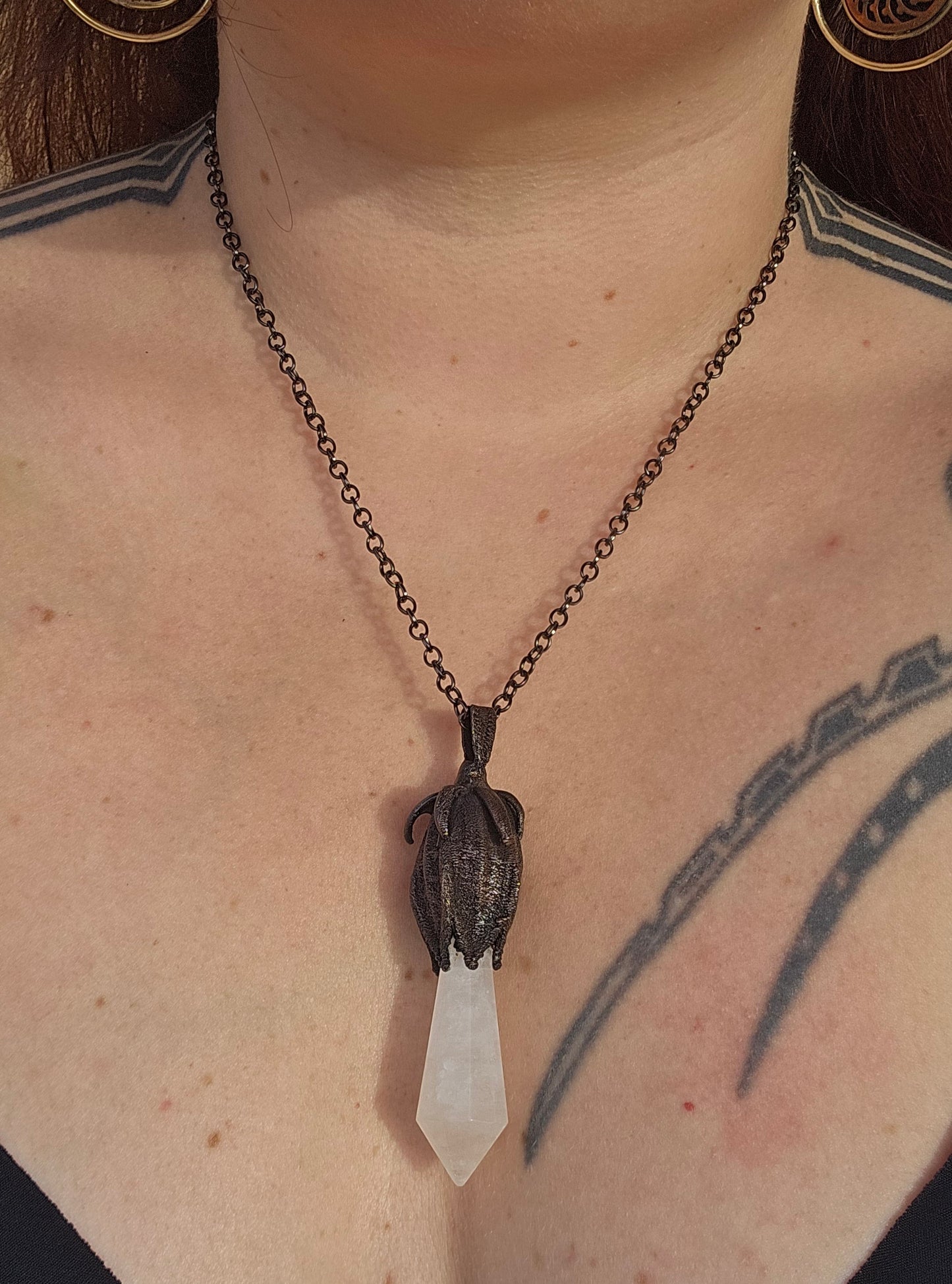 quartz point copper eformed on a real hibiscus bud, with a dark gunblack patina, medium long delicate dark fairy goth necklace
