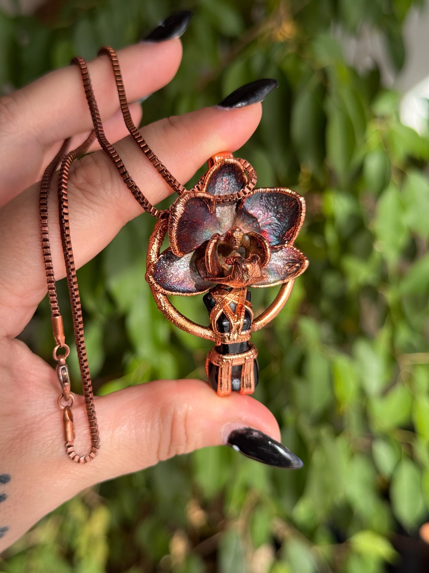 Carved obsidian with a real orchid eformed in copper ,  naughty fairy,  delicate necklace on medium chain